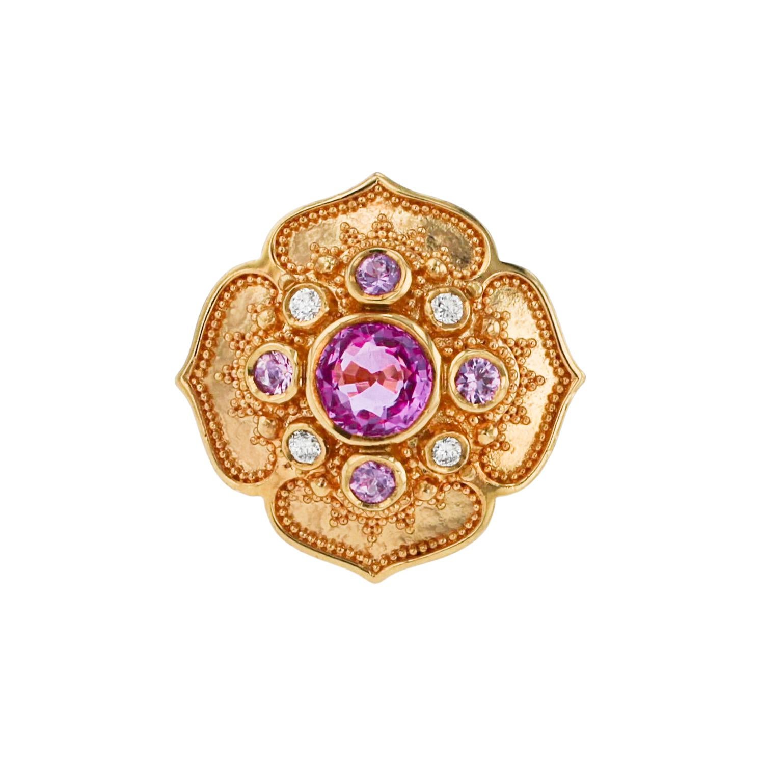 This refreshing Flower Ring comes from the limited edition Kent Raible 'Studio Collection'. Full of life and sparkle, the cluster of gems features a 1.36 carat central Pink Sapphire surrounded by soft pink Sapphires and the brilliance of Diamonds.