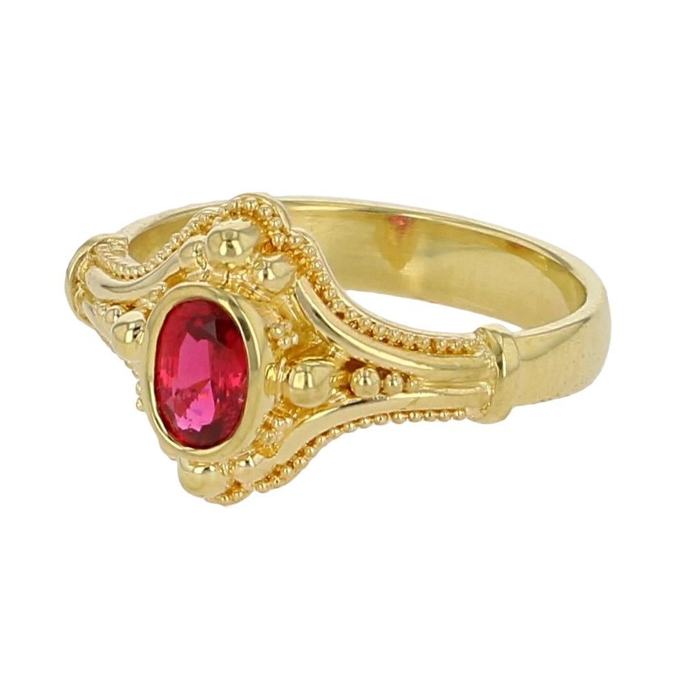 From the Kent Raible limited edition Studio Collection we present his lovely oval solitaire ring featuring a lively deep red Spinel. The fine granulation detail serve to further highlight this lovely gem, which, has become quite popular with its