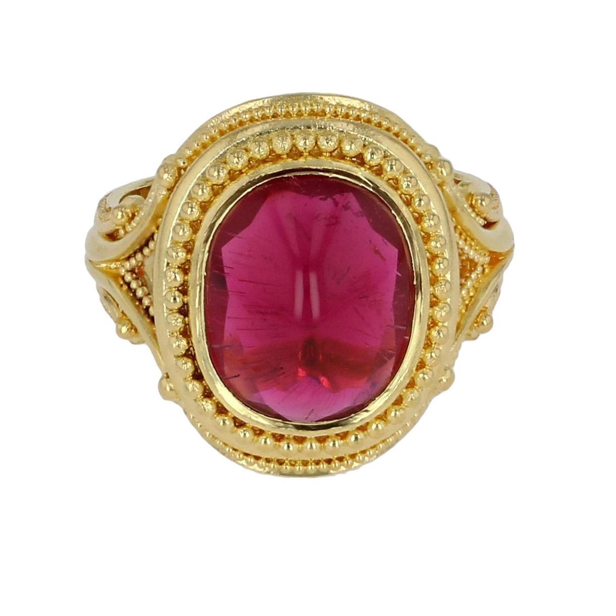 From the Kent Raible one of a kind Masterworks Collection  we bring you his buff top Rubellite Tourmaline Ring. This rich red cabochon is faceted underneath and cut to a high ridge on top, accentuating the lively inclusions in this natural stone.