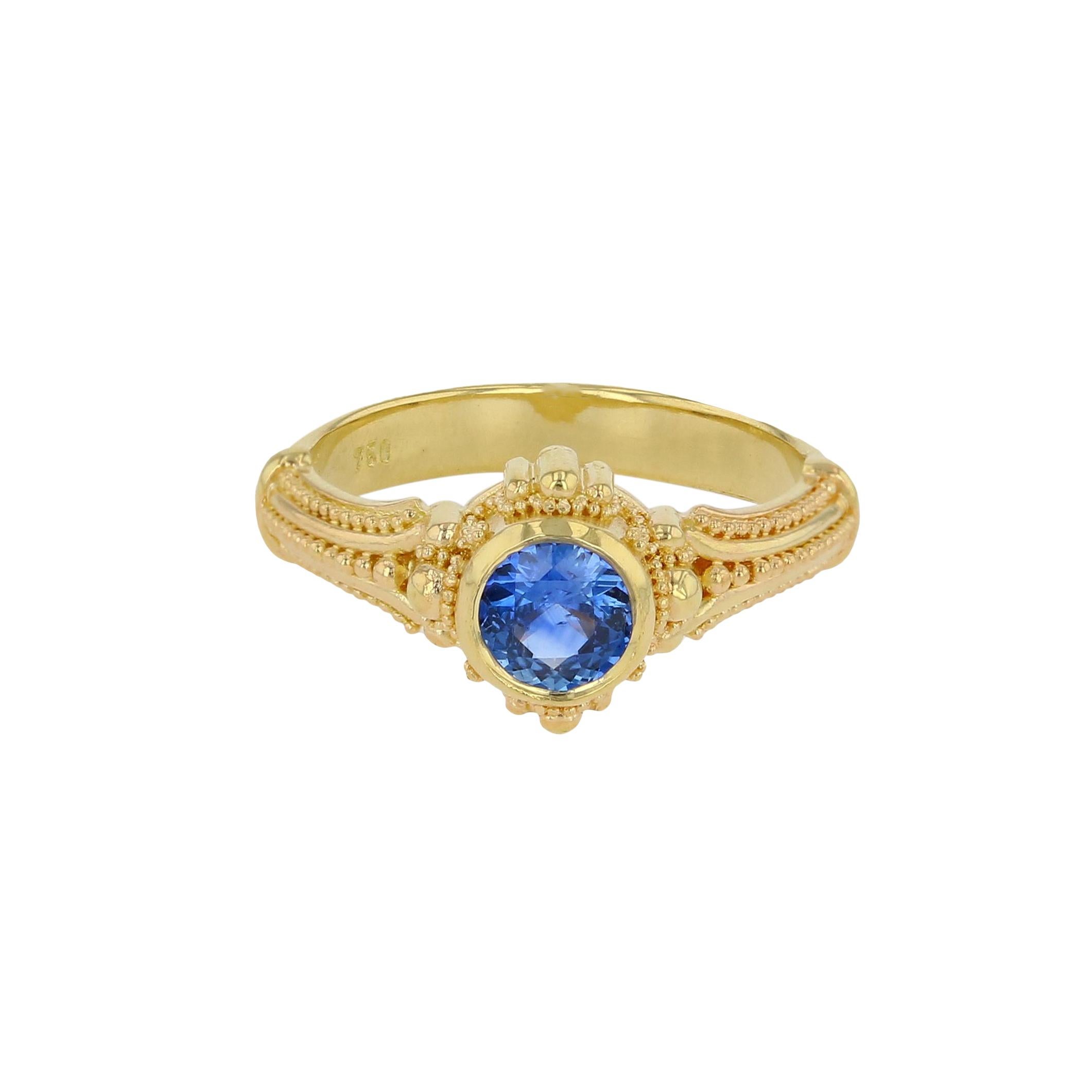 What a beautiful Cornflower Blue Sapphire! It just glows. Raible's use of 18 karat gold with it's lovely detailing, frames this stunning Blue Sapphire  beautifully and really brings this gem to life!

Blue Sapphire .91ct
6.7 grams 18 Karat Gold
Size