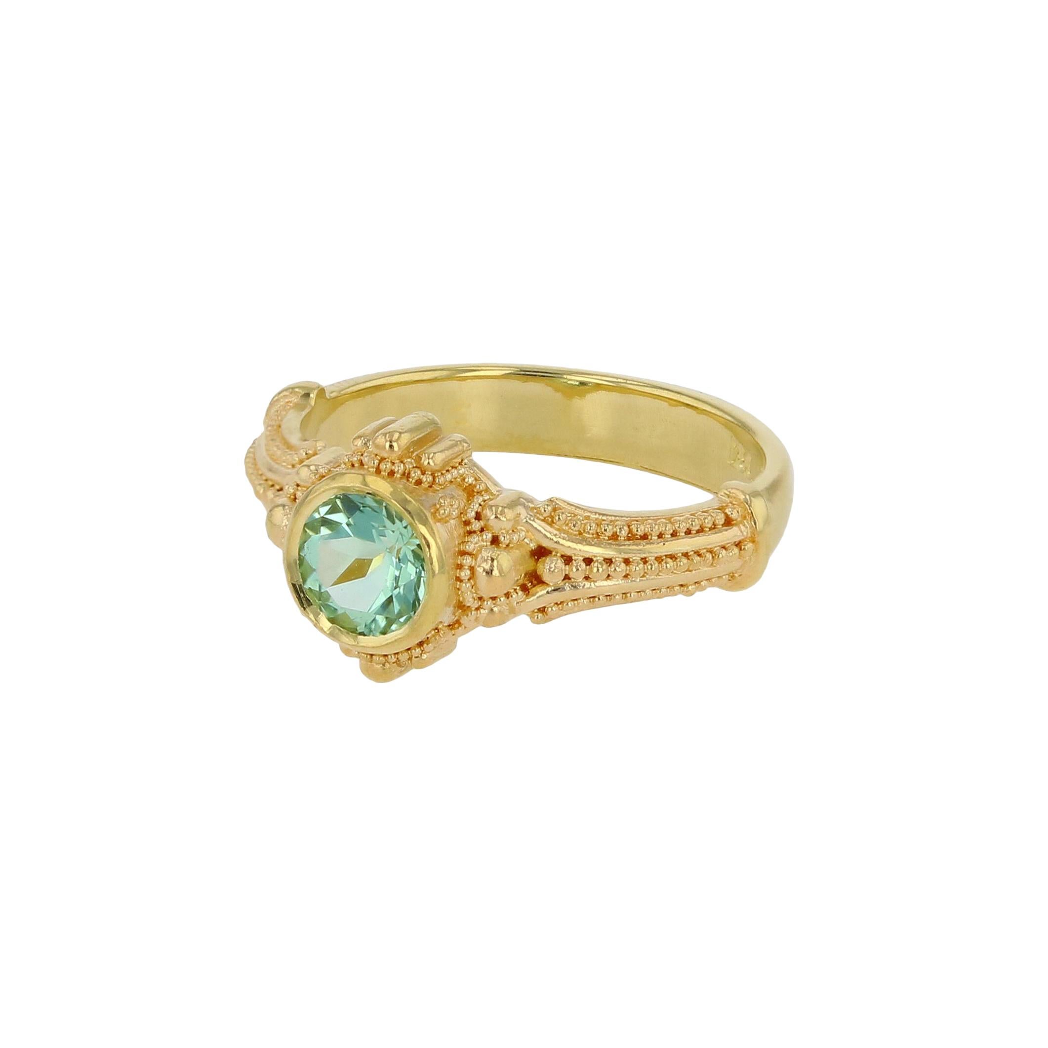 The soft but bright and alluring glow of Seafoam Tourmaline is on full display in Kent Raible's solitaire ring. The fine detailing and granulation create the perfect frame, not overpowering but serve to inhance the beauty of this gemstone.

This