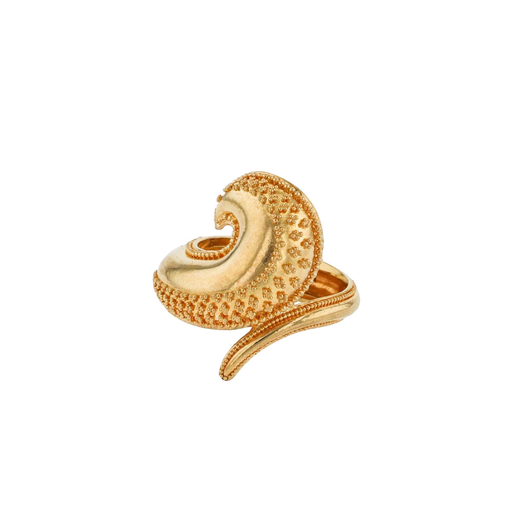 A unique ring from the Kent Raible Studio Collection! The Golden Wave Ring wraps around the finger as the wave curls on the finger displaying an elegant taper of fine granulation! It's a stunning look, but don't wear it with loose knits as it could