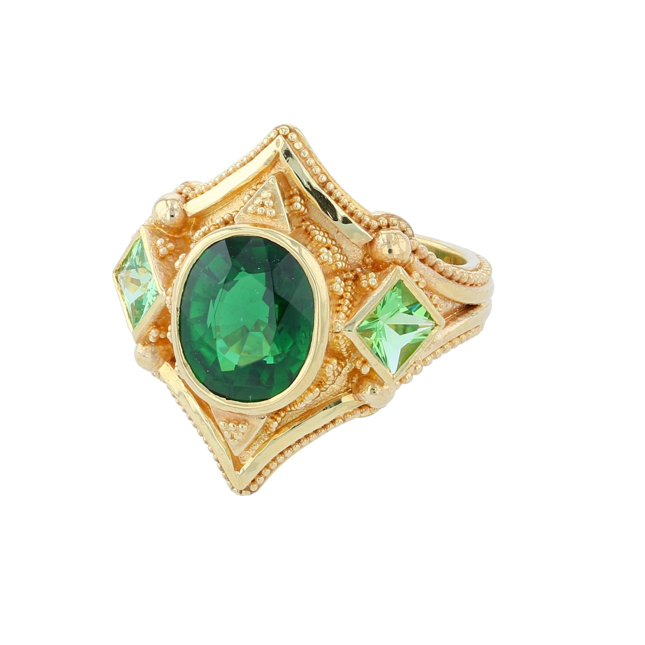 Kent Raible's bespoke ring 'Shades of Green' brings fluid lines and fine granulation nestled in a lovely and bold golden boarder with all the fine detail and accents we expect to find in a Raible original. His love for Chrome Tourmaline meets his