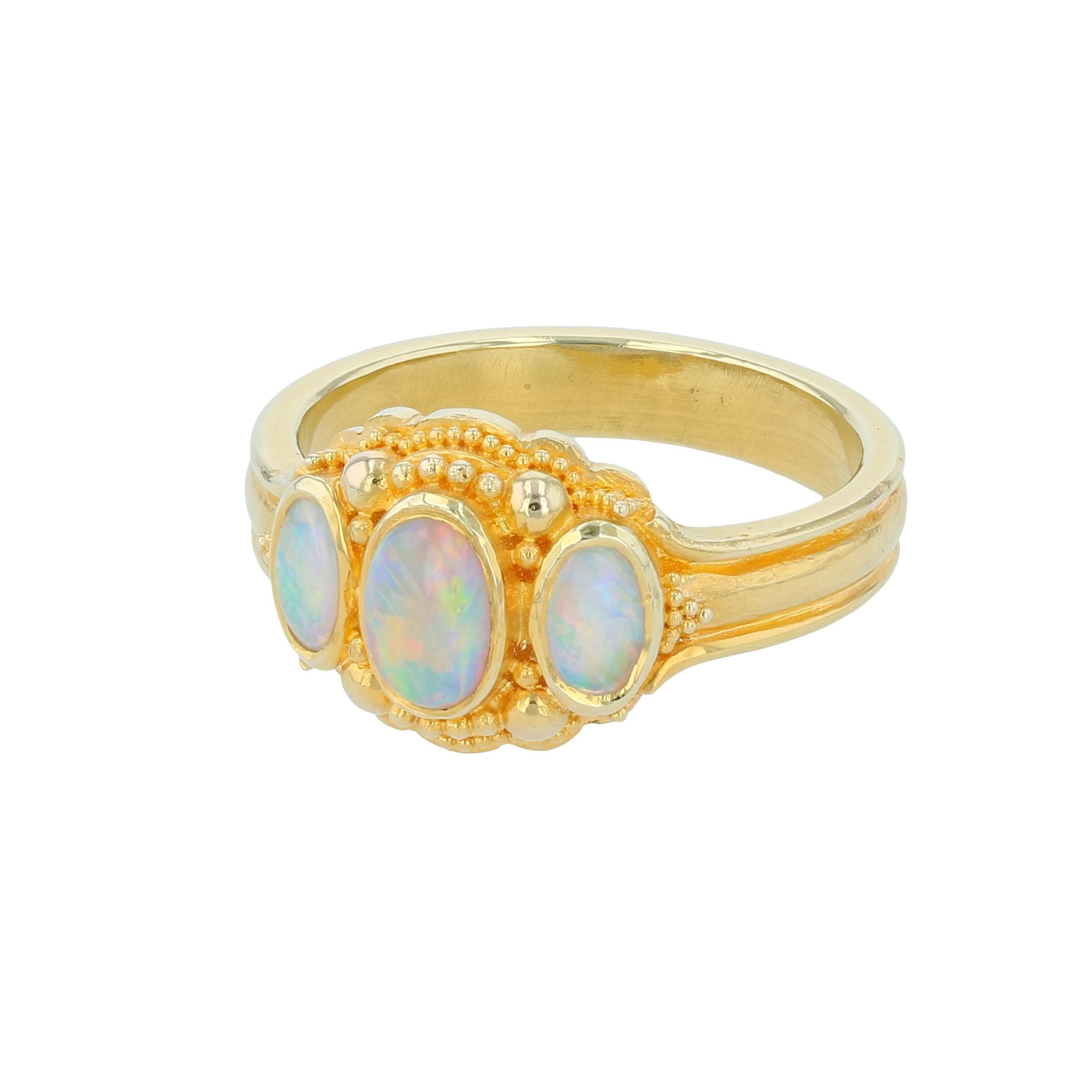 From the Kent Raible limited edition 'Studio Collection' we bring you the Three-Stone Opal Ring.
Top quality natural Australian Crystal Fire Opal is stunning set in 18 karat gold with Kent's signature granulation detail.
**Image on the hand is the