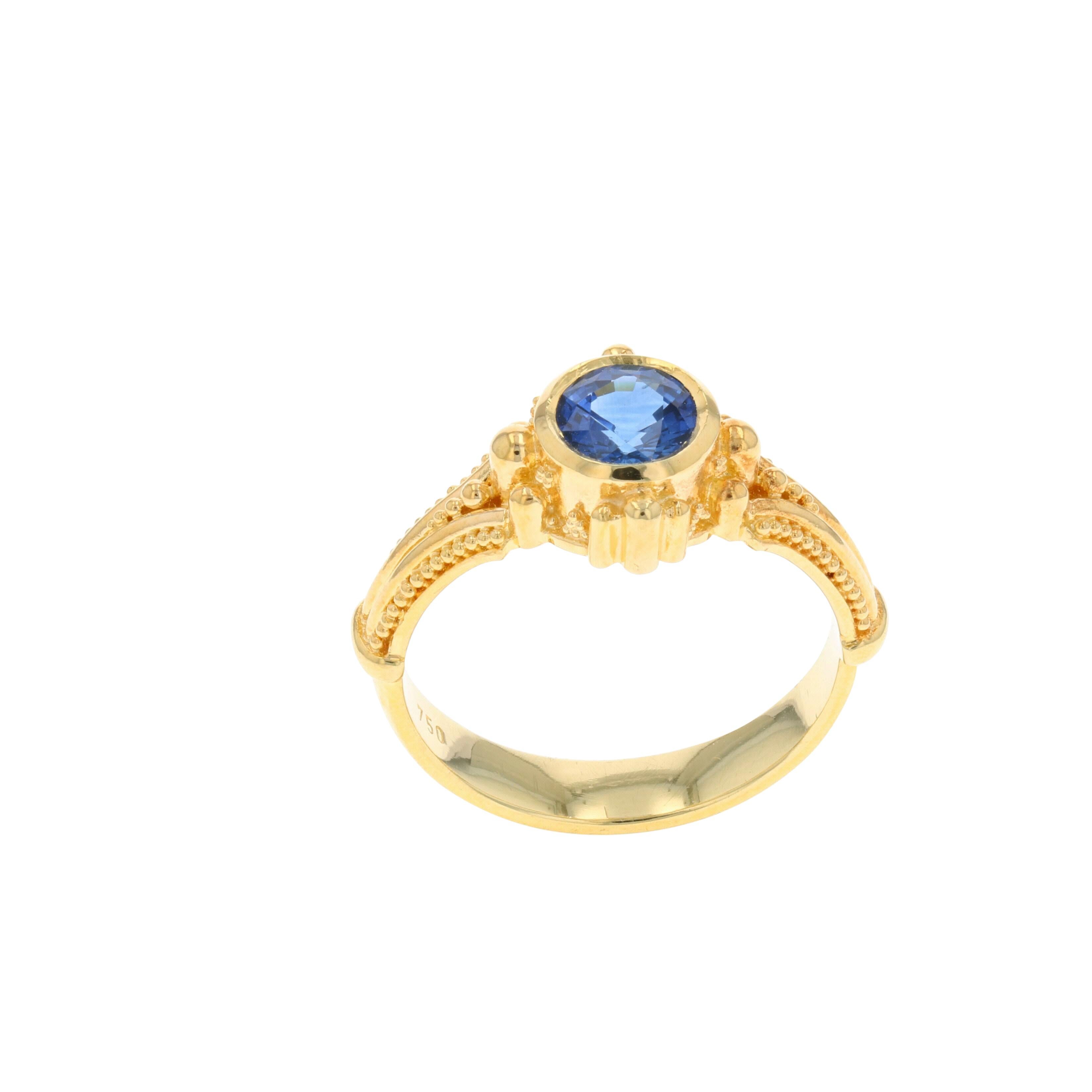 This Blue Sapphire ring, with elegant granulation detail is from the Kent Raible limited edition 'Studio Collection'. Raible's use of 18 karat gold with it's lovely detailing, frames this stunning Blue Sapphire  beautifully and really brings this