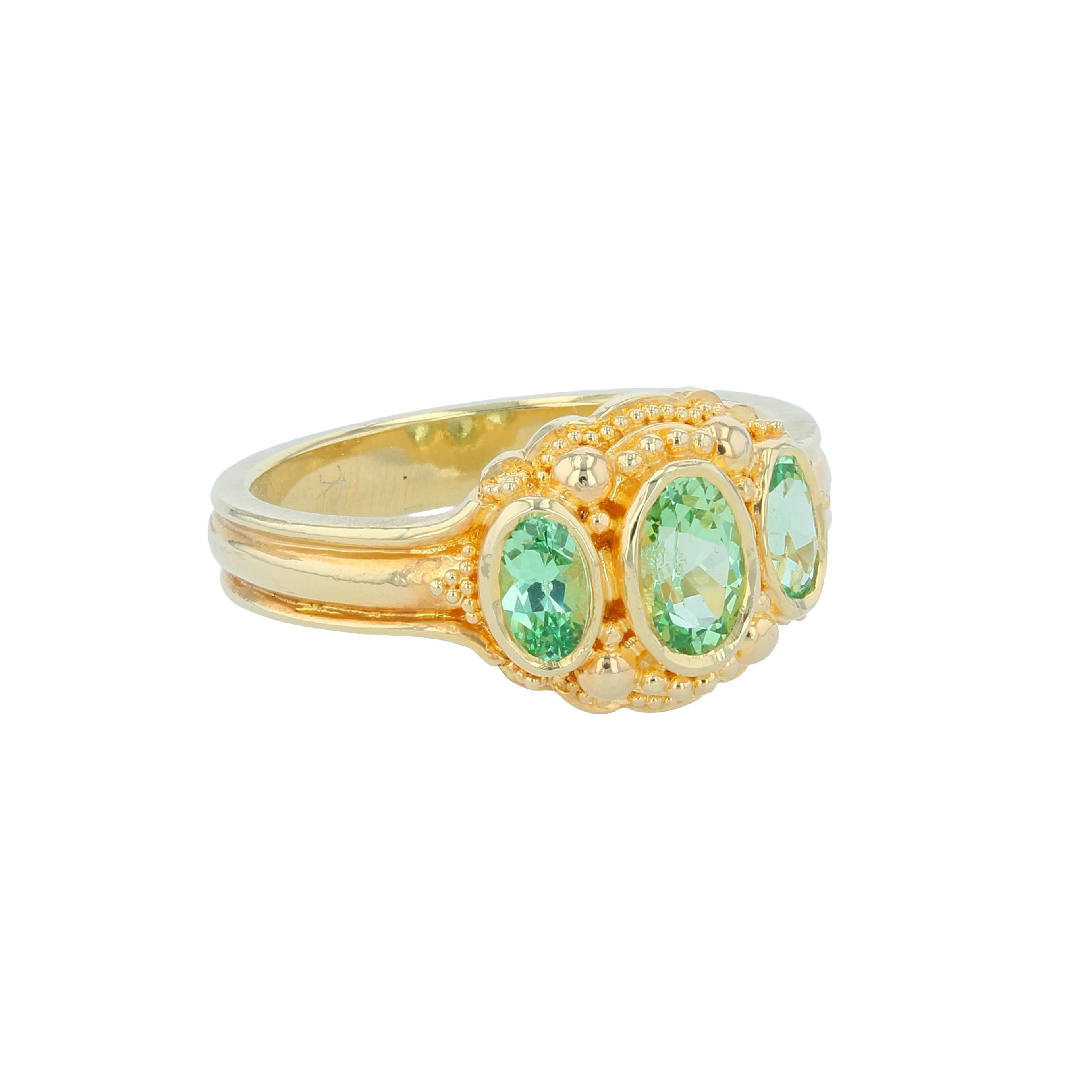 From the Kent Raible limited edition 'Studio Collection' we bring you the Three-Stone Green Grossular Ring.
These top quality Green Grossular Garnets have a refractive index close to that of Diamond which give them a dazzling effect. All that