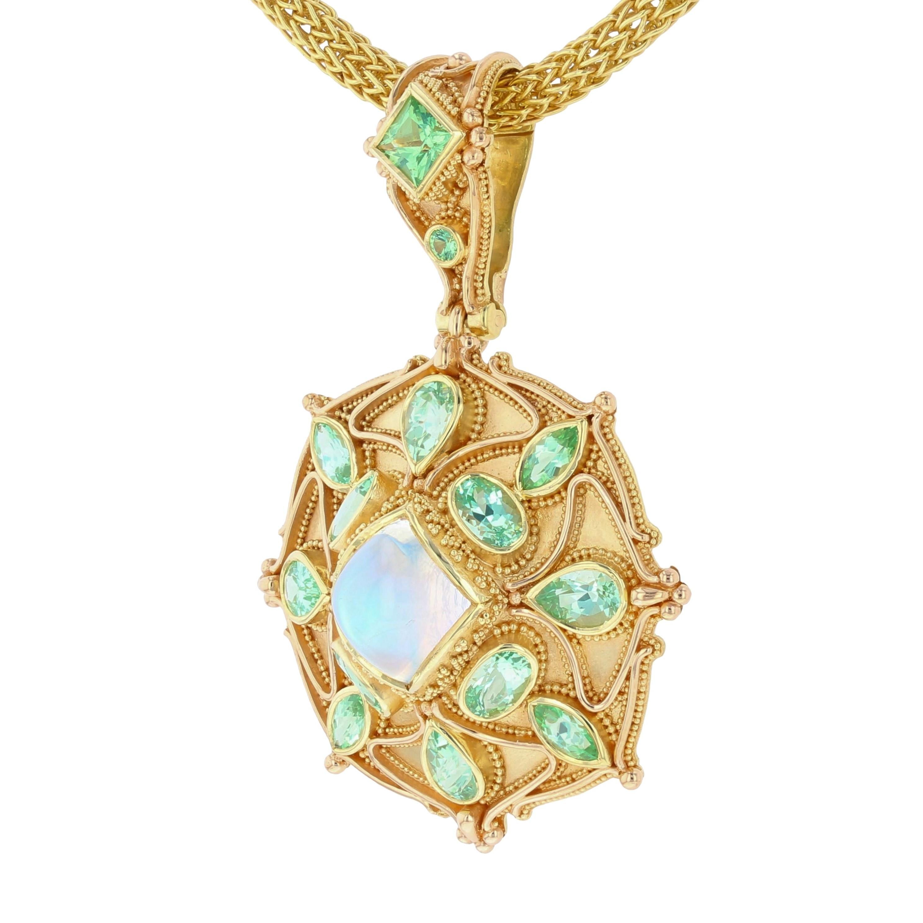 From the Kent Raible one of a kind Masterworks Collection, we bring you the 'Moonstone Mandala' pendant enhancer. At it's center is a flawless multi-colored rainbow moonstone. Accenting the Moonstone are a suite of brilliant mint green Grossular