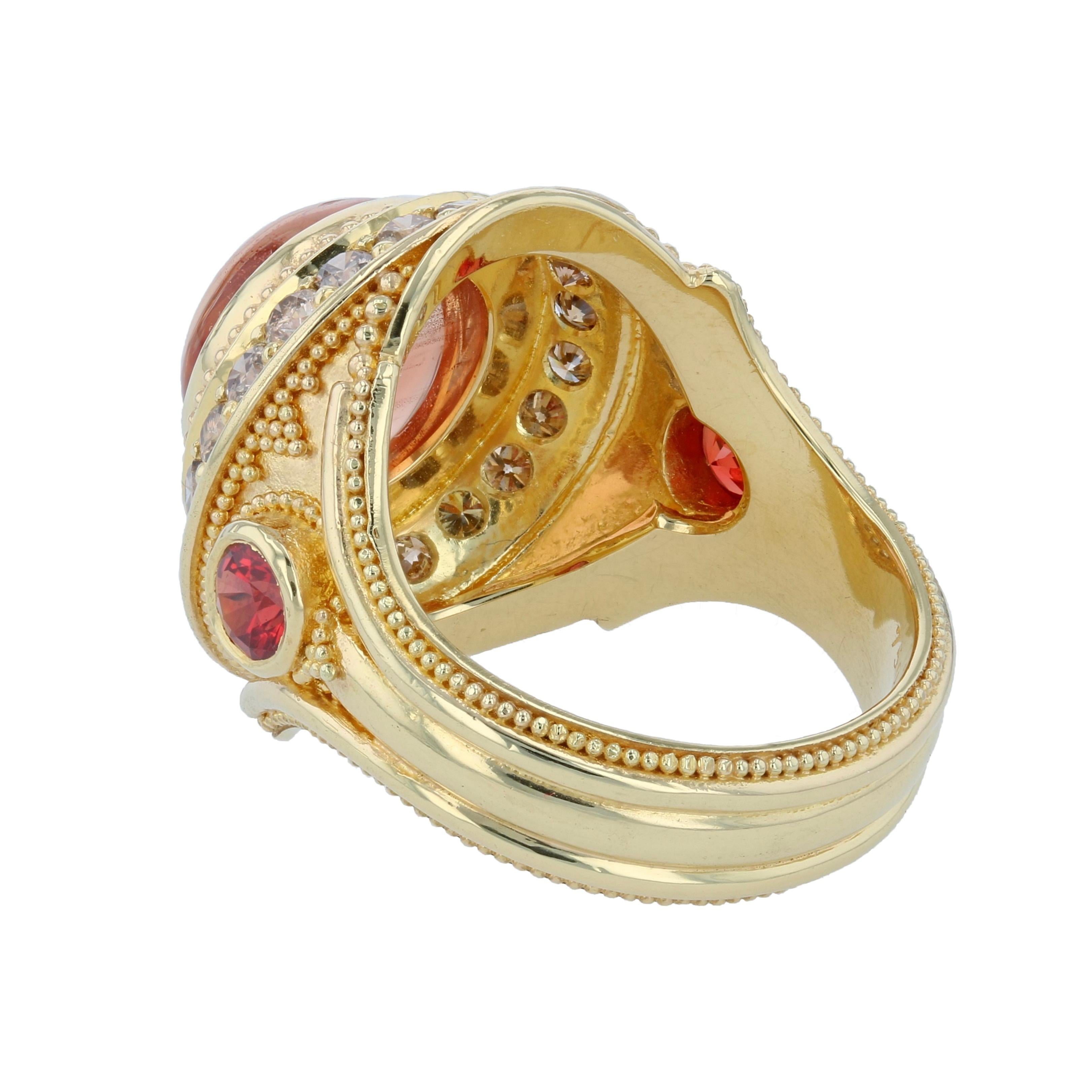 Experience the magic of Kent Raible's Bespoke Sunstone and brown - Cognac Diamond cocktail ring. The adularescence, or schiller, in this natural Oregon Sunstone adds a pleasing allure. The Cognac diamonds surround it lending an elegant sparkle, and