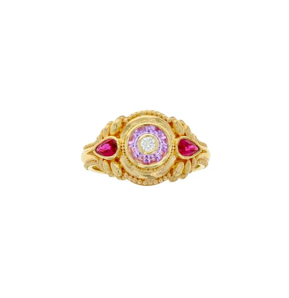 Master Goldsmith Kent Raible's one of a kind ring has been hand fabricated in 18 karat gold with elegant detailing and fine granulation. 

The Pink Sapphire has been cut by master gem carver Glenn Lehrer. This is Glenn's patented 'Torus Ring' cut,