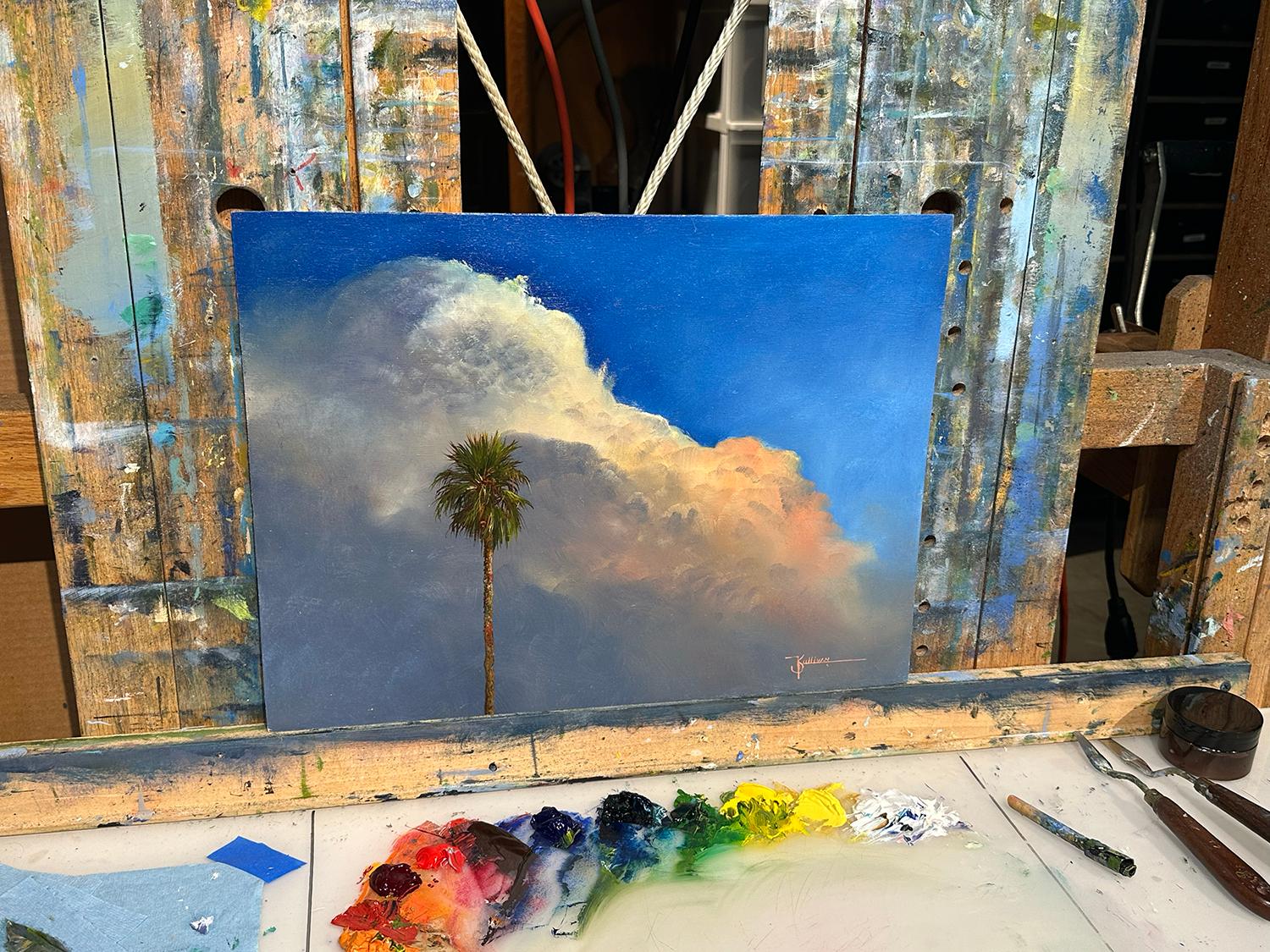 <p>Artist Comments<br>A tall palm tree stands against an evening thunderhead, illuminated by the warm glow of the setting sun. Carefully blended colors capture the essence of the dramatic sky and majestic silhouette of the tree. Artist Kent