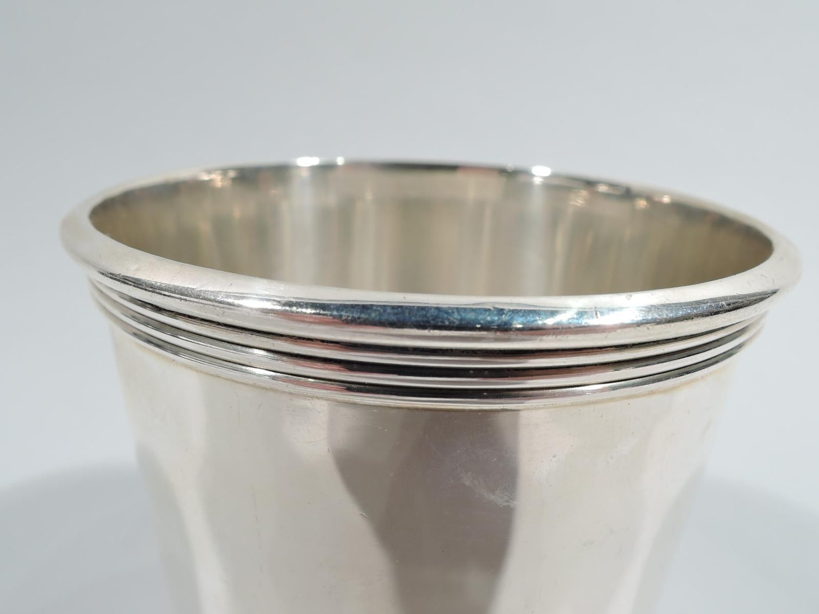 For the home stretch—sterling silver mint julep cup. Straight and tapering sides, and reeded rim and foot. Fully marked including retailer’s stamp for AJ Winters Co., which was located in Paris, Kentucky. Weight: 4 troy ounces.