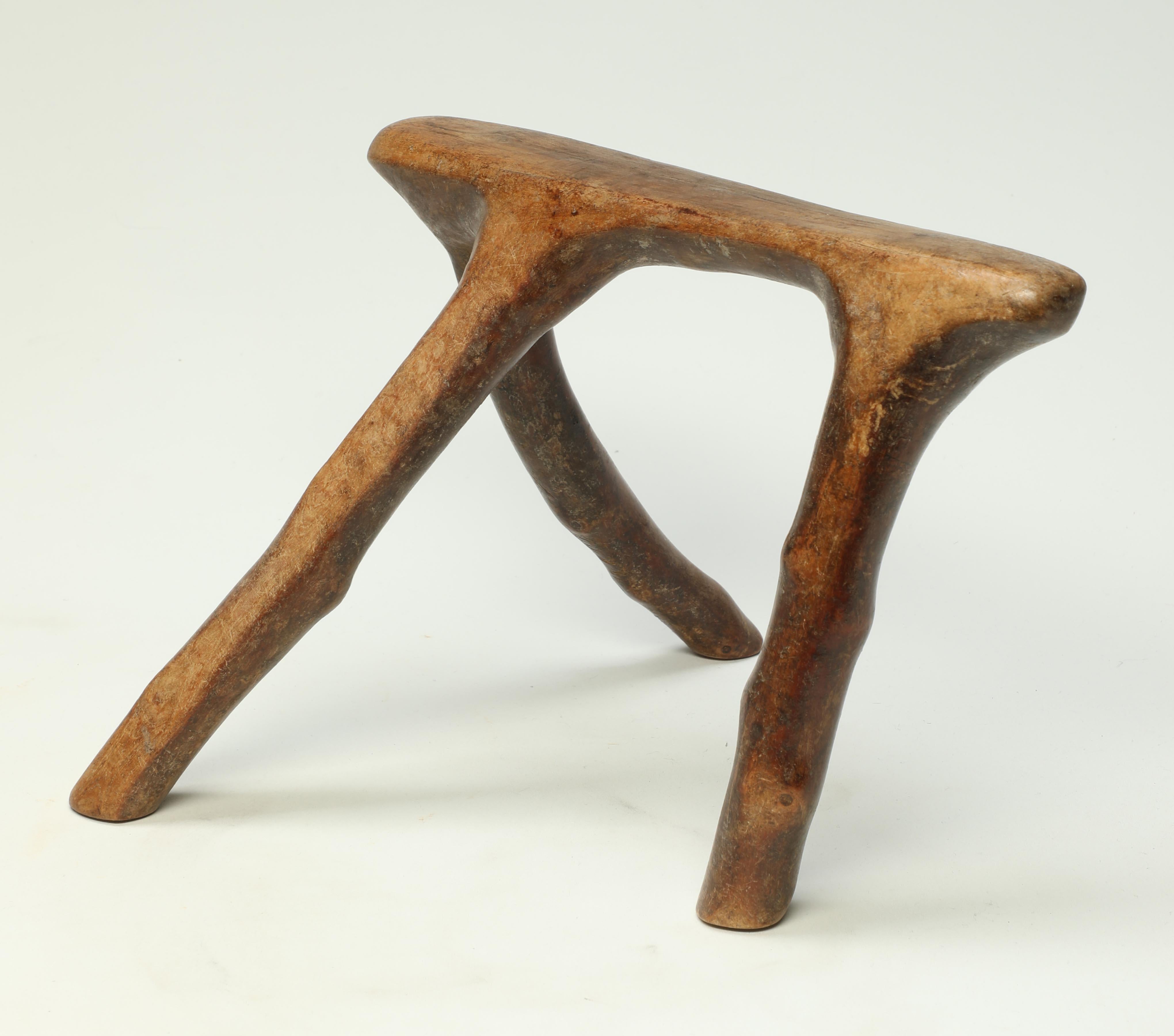 Kenya tribal wood headrest, stylized natural animal form, early 20th century, African.

Early Rendille or Borana Headrest from Kenya. Using naturally found branch connections to form a stylized three legged animal form, these headrests were a