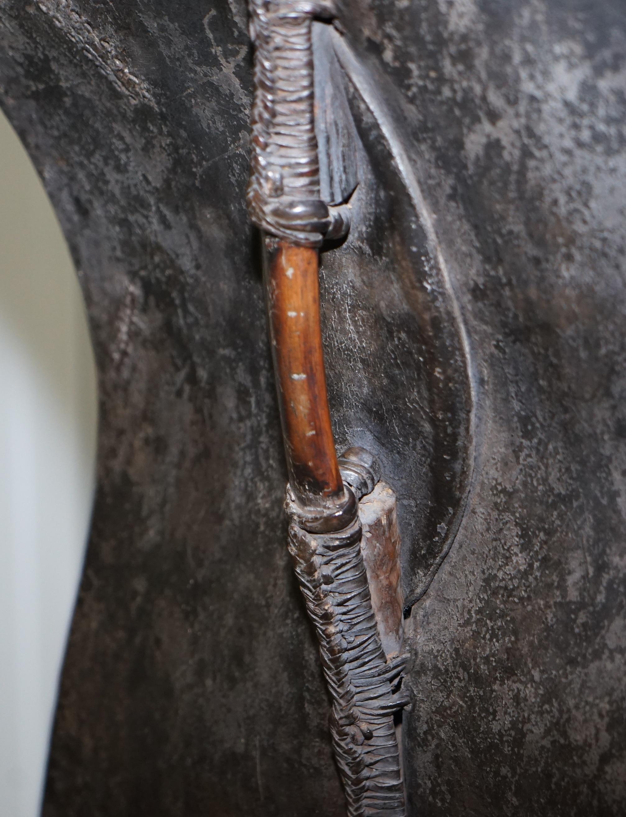 Kenyan African Turkana Leather and Iron Fighting Shield Regency Hardwood Base For Sale 13