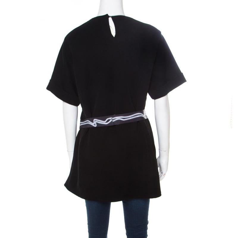 This Kenzo top is a perfect blend of quality and comfort. Black in color, this gorgeous piece would make you stand out from the crowd. Styled with a contrasting belt, this piece is a must-have in your everyday wardrobe.

Includes: The Luxury Closet