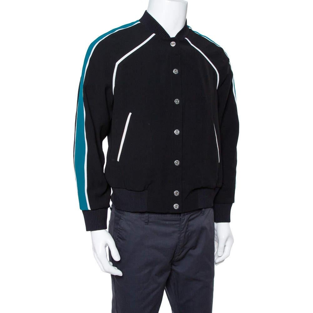 Get that simple yet in-style look with this Kenzo bomber jacket. Crafted from quality fabrics, it comes in a lovely shade of black. It has a buttoned front, a colorful print at the back, long sleeves, and a good fit. It is great for impromptu