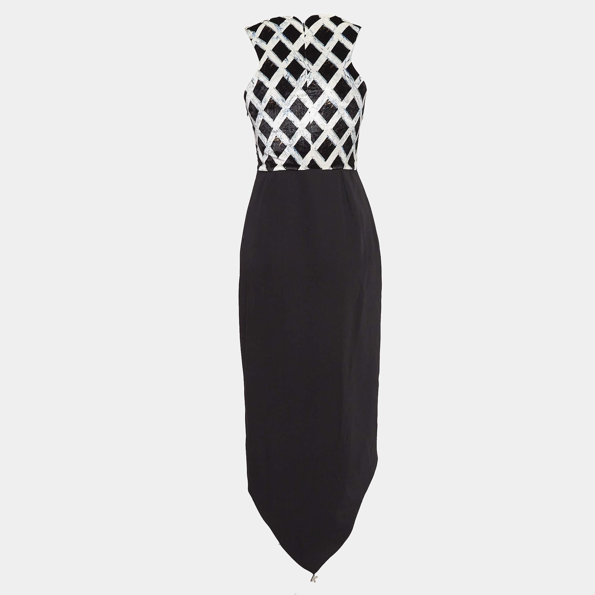 Step into timeless elegance with this Kenzo dress. Meticulously crafted it embodies grace and sophistication making it the perfect choice for those seeking an exquisite wardrobe addition.