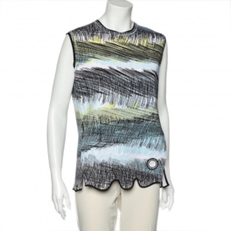 Kenzo vous propose ce top oversize sans manches issu de la Collection S 2014. Confectionné en néoprène, il présente une encolure ronde, un imprimé de peinture abstraite et un ourlet incurvé qui lui confère une touche d'élégance. Associez-le à un