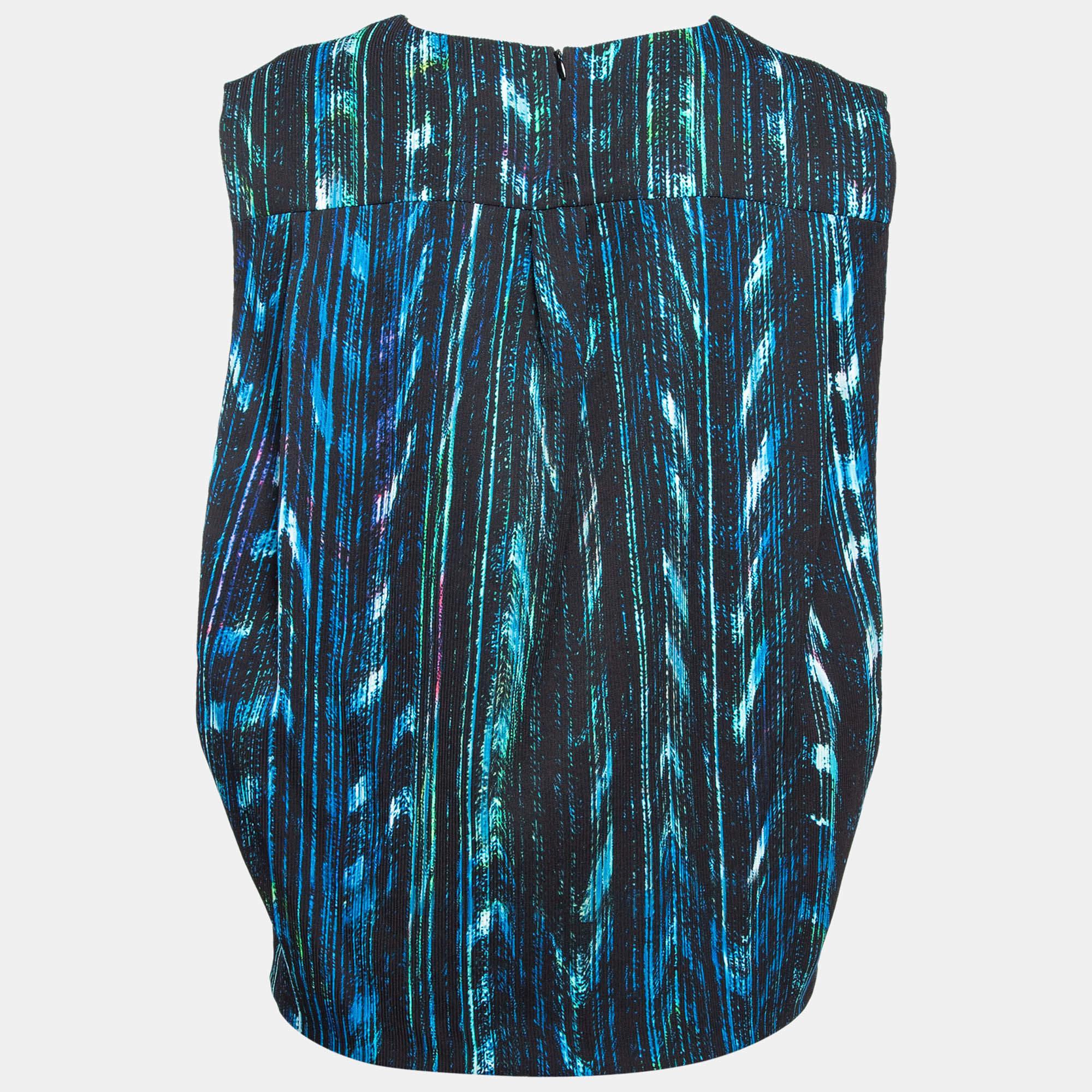 Go for stylish comfort with this top from Kenzo. This elegant sleeveless top can be easily teamed with skirts pants or shorts. It has a round neckline back zipper and prints all over.