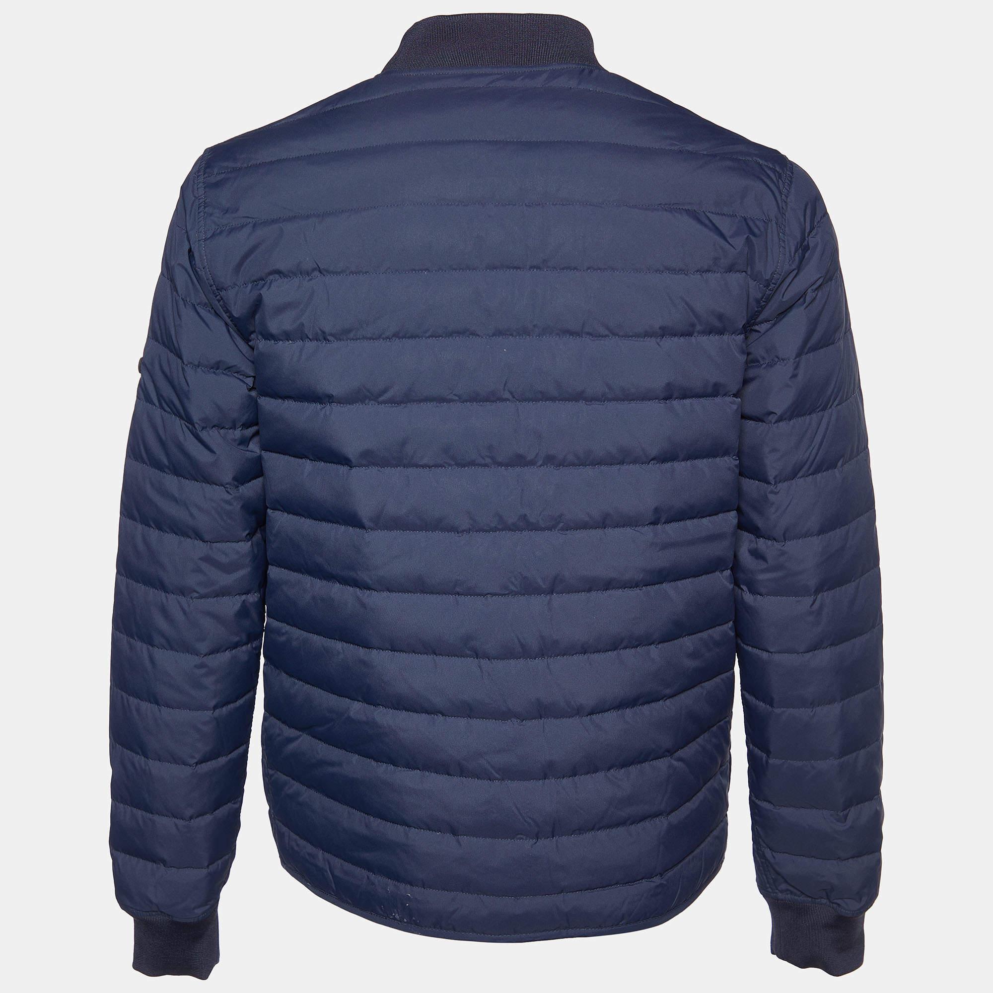 The Kenzo jacket is a versatile fashion piece. On one side, it showcases a vibrant blue color with a unique print, while the reverse side offers a classic quilted design. This jacket combines style and functionality, making it a must-have addition