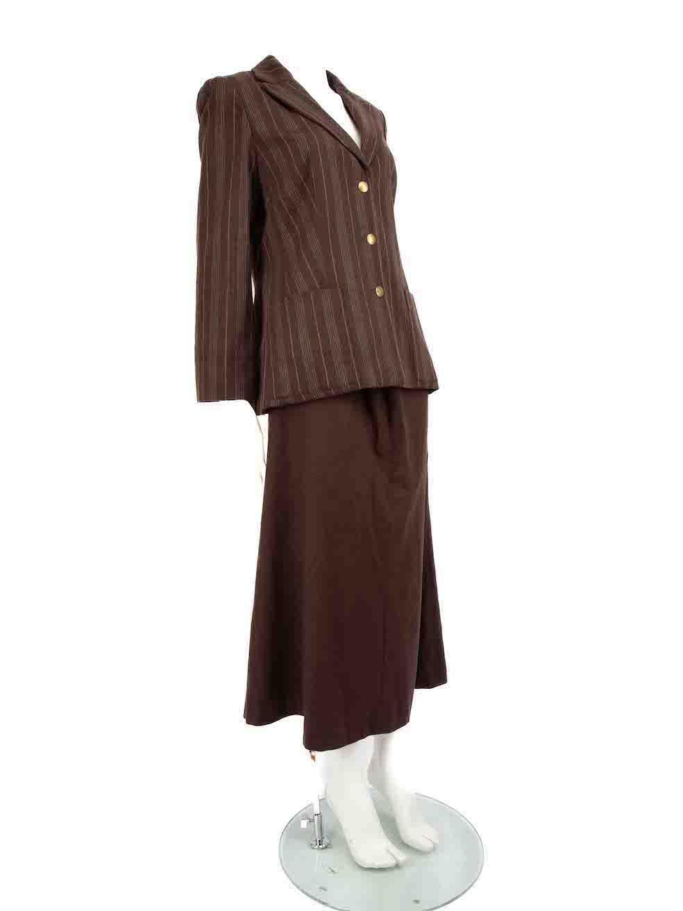 CONDITION is Very good. Minimal wear to the set is evident. Minimal wear to the buttons is seen with tarnishing however, the skirt has hardly any visible wear on this used Kenzo Jungle designer resale item.
 
 
 
 Details
 
 
 Brown
 
 Wool
 
 Skirt