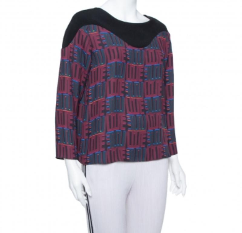 An inimitable blend of art and ever-changing fashion, this Kenzo top is made for the daring fashionista. This extravagant Burgundy top exhibits a well-balanced blend of comfort and style in its design. This unique crepe top caters to boho-luxe