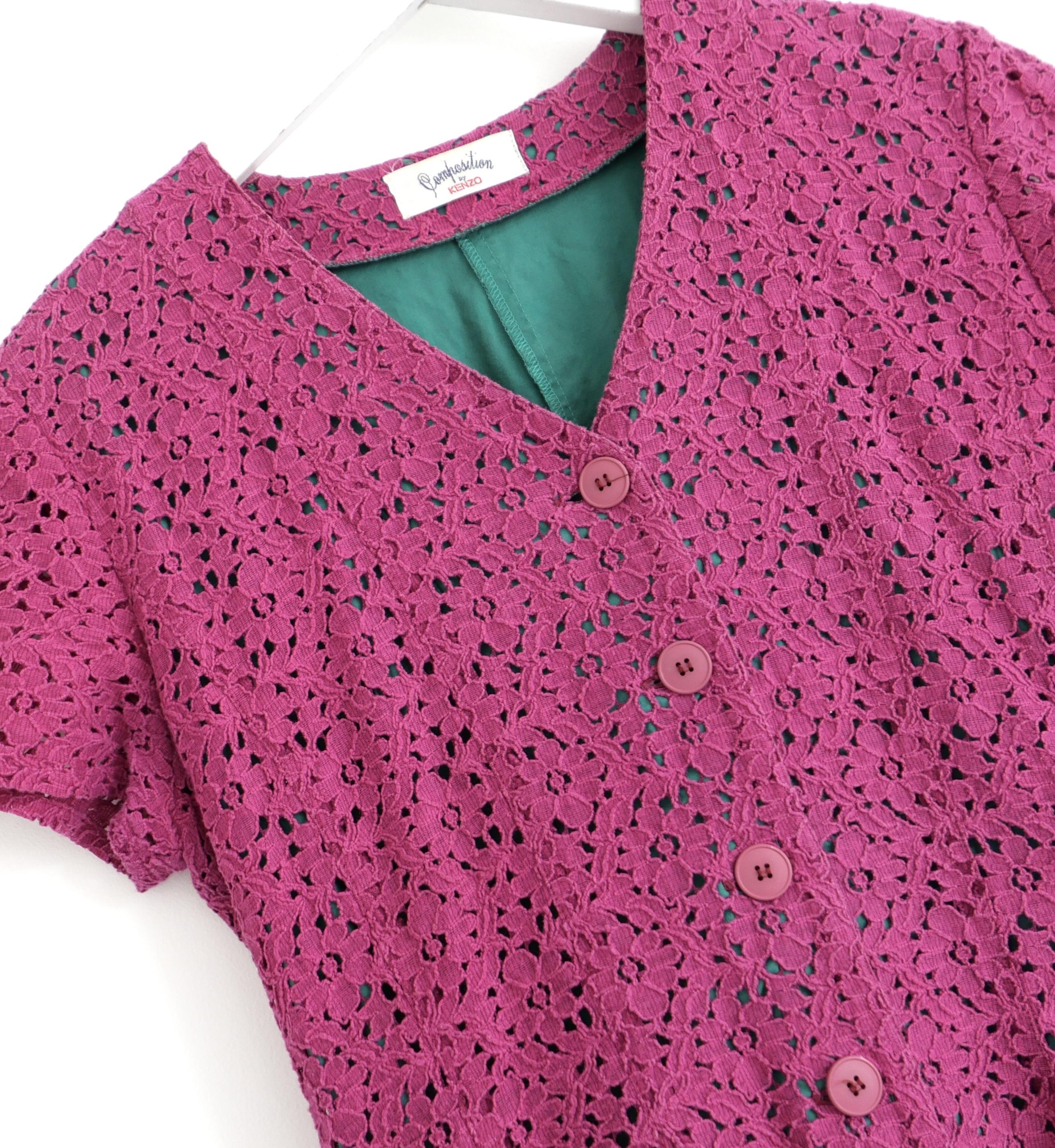 Adorable, fun and flirty vintage Kenzo dress from the 1980s Composition By Kenzo line. Made from magenta pink broderie anglais cotton with an emerald green cotton inner.  It has the most flattering cut with tailored, button front bodice and super