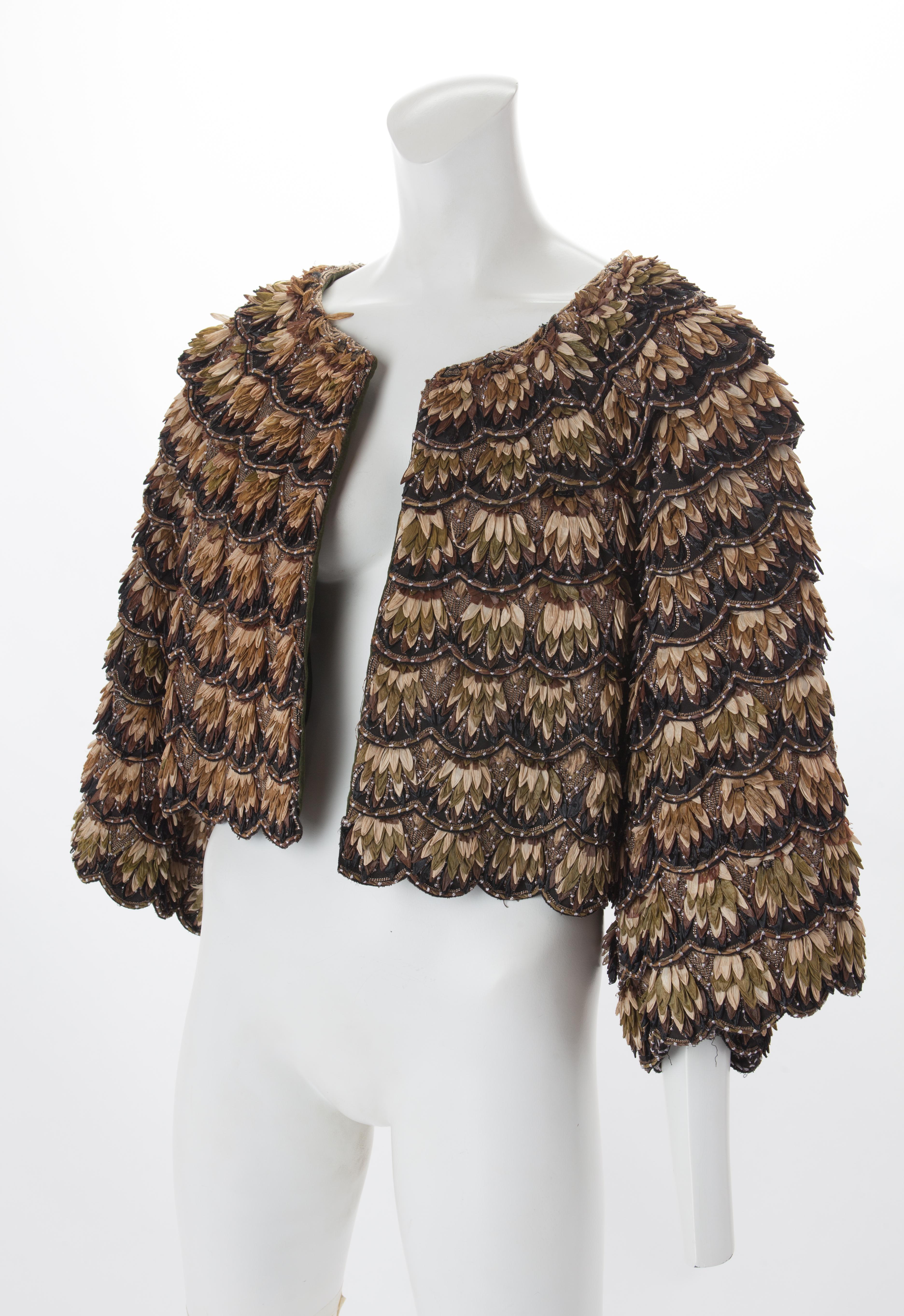 KENZO Couture Raffia Jacket, c.2000s.
Black, brown, and beige cropped jacket wide sleeves and all-over tiered horizontal panels. Embellished with layered raffia 