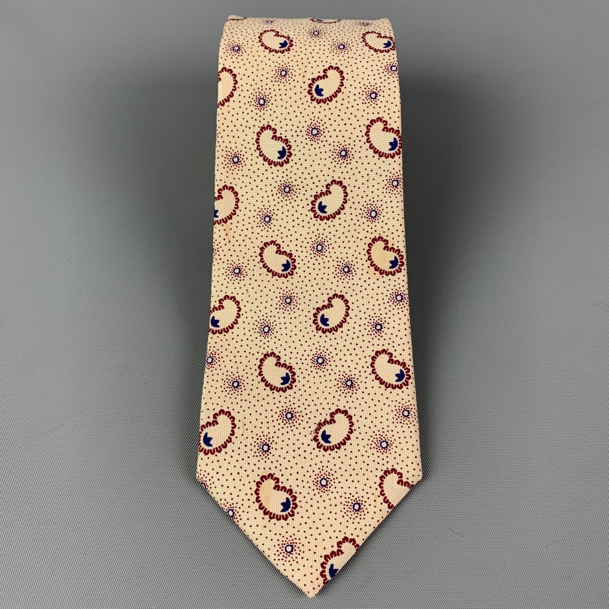 KENZO
necktie comes in a cream& burgundy material with a all over dot print.  Good Pre-Owned Condition. 

Measurements: 
  Width: 2.75 inches  Length: 56 inches 
  
  
 
Reference: 119903
Category: Tie
More Details
    
Brand:  KENZO
Color:  Cream &