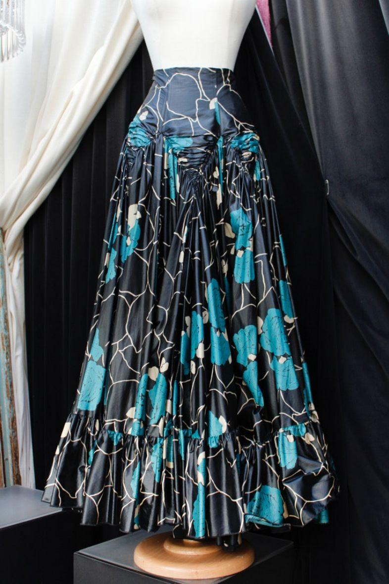 Kenzo Defile by Antonio Marras – Wide skirt composed of coated canvas in black, blue, and white tones. Back zip closing. No lining. No composition tag . No indicated size, it fits a size 40FR - 42FR. 2009 ready-to-wear collection.

Additional