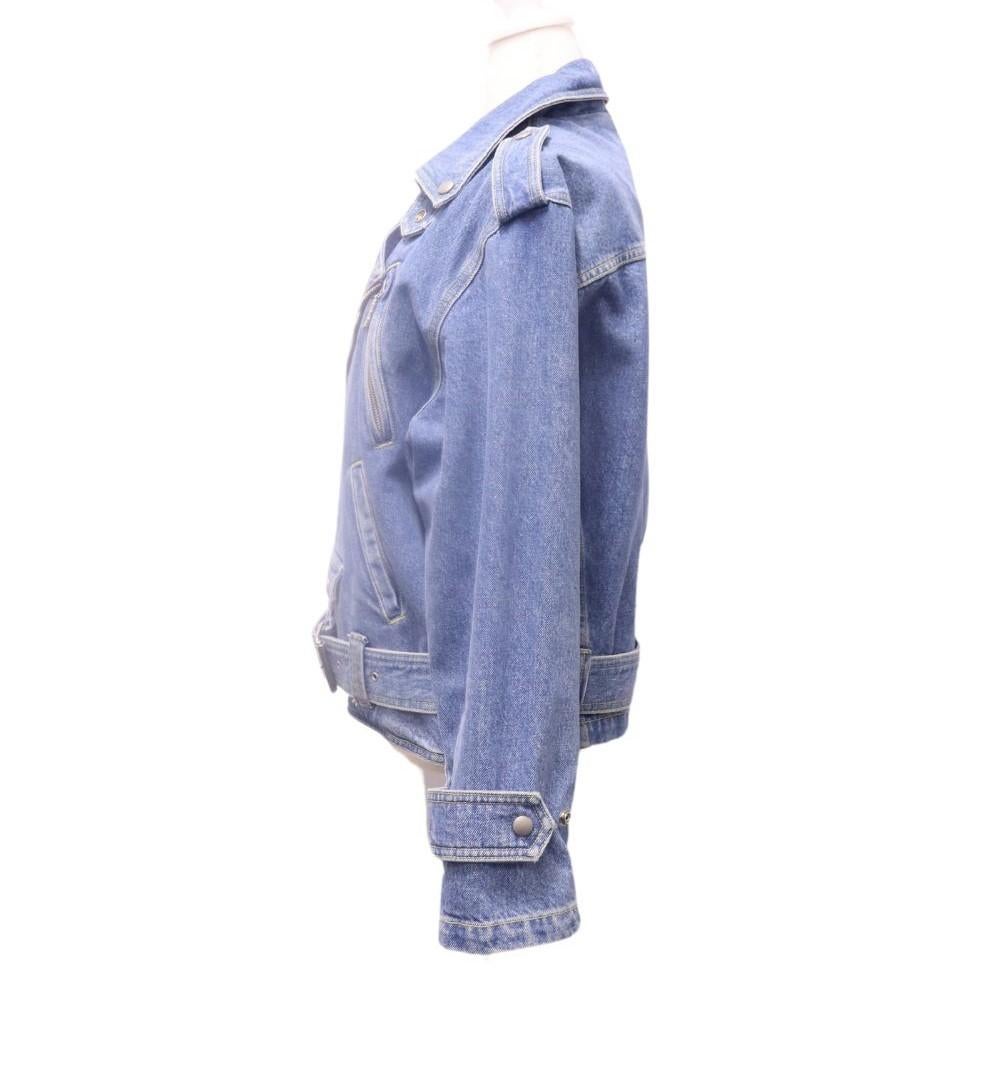 Kenzo Denim Belted Biker Jacket, Features long sleeves, zipper pockets, and a motorcycle jacket styling.

Material: 100% Cotton
Size: EU 38 / M
Bust: 110cm
Waist: 100cm
Overall Condition: Excellent