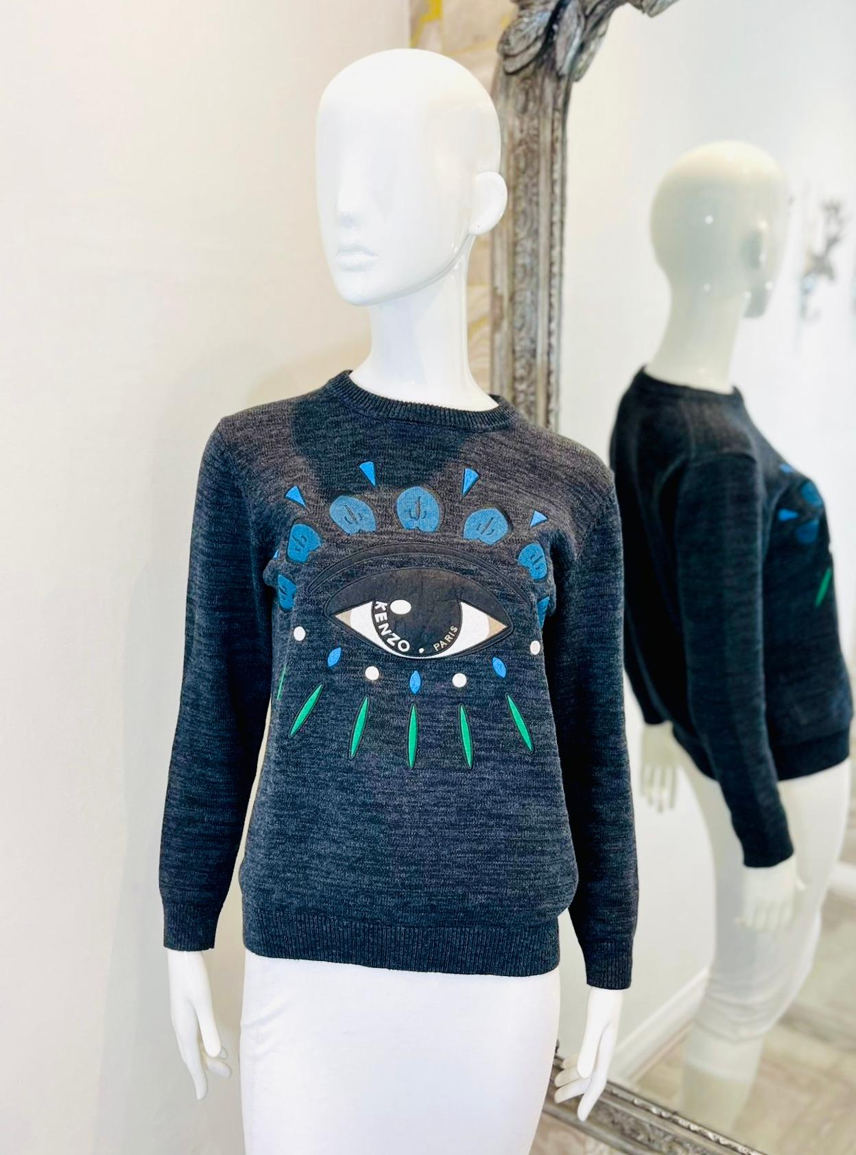 Kenzo 'Eye' Motif Cotton Jumper

Dark grey jumper designed with iconic 'Eye' motif to the centre detailed with white 'Kenzo Paris' lettering.

Featuring crew neckline, ribbed cuffs and hem and regular fit.

Size – S

Condition – Very