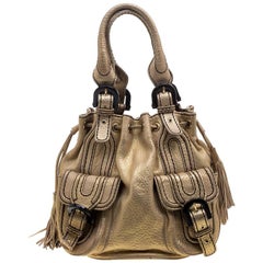 Kenzo Beuteltasche aus goldfarbenem Leder mit Kordelzug und Nieten