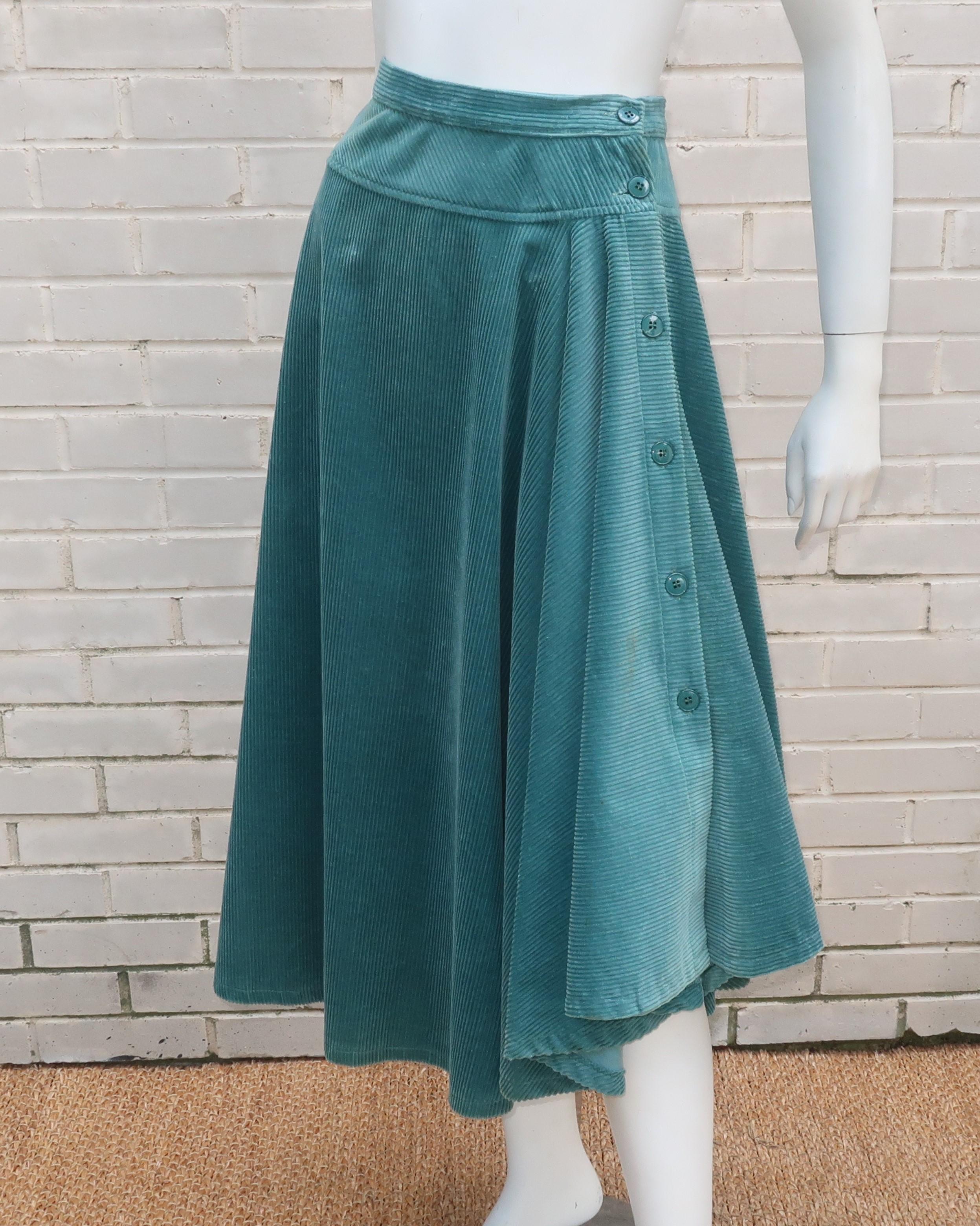 1970’s sea foam green wide wale corduroy skirt by Kenzo for his early Jungle Jap label.  The unique design buttons up on the side with a handkerchief style hemline and an asymmetrical cut.  Perfect to pair with a cropped sweater or