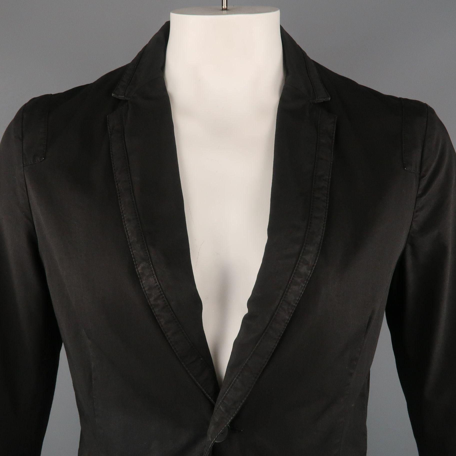 KENZO sport coat comes in a black cotton featuring a notch lapel style, two button closure, and front flap pockets.
 
Very Good Pre-Owned Condition.
Marked: L
 
Measurements:
 
Shoulder: 20 in.
Chest: 42 in.
Sleeve: 22.5 in.
Length: 29 in.