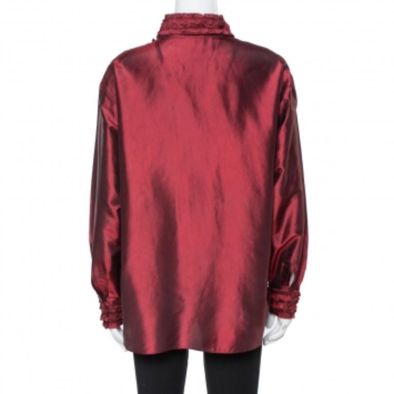 This Kenzo top upgrades your style quotient taking it a couple of notches higher. This gorgeous maroon blouse is made from silk and flaunts ruffled details on the placket, cuffs, and collar. Tuck it in a sharp pencil skirt and wear strappy heels.