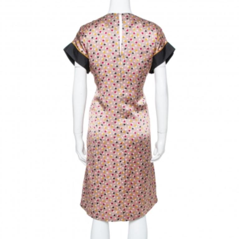 This exquisite Kenzo dress is sure to get you compliments each time you go out. An outfit like this will remain a timeless classic in your wardrobe. A fine balance of comfort and style, this silk dress is a closet staple and features polka dots all