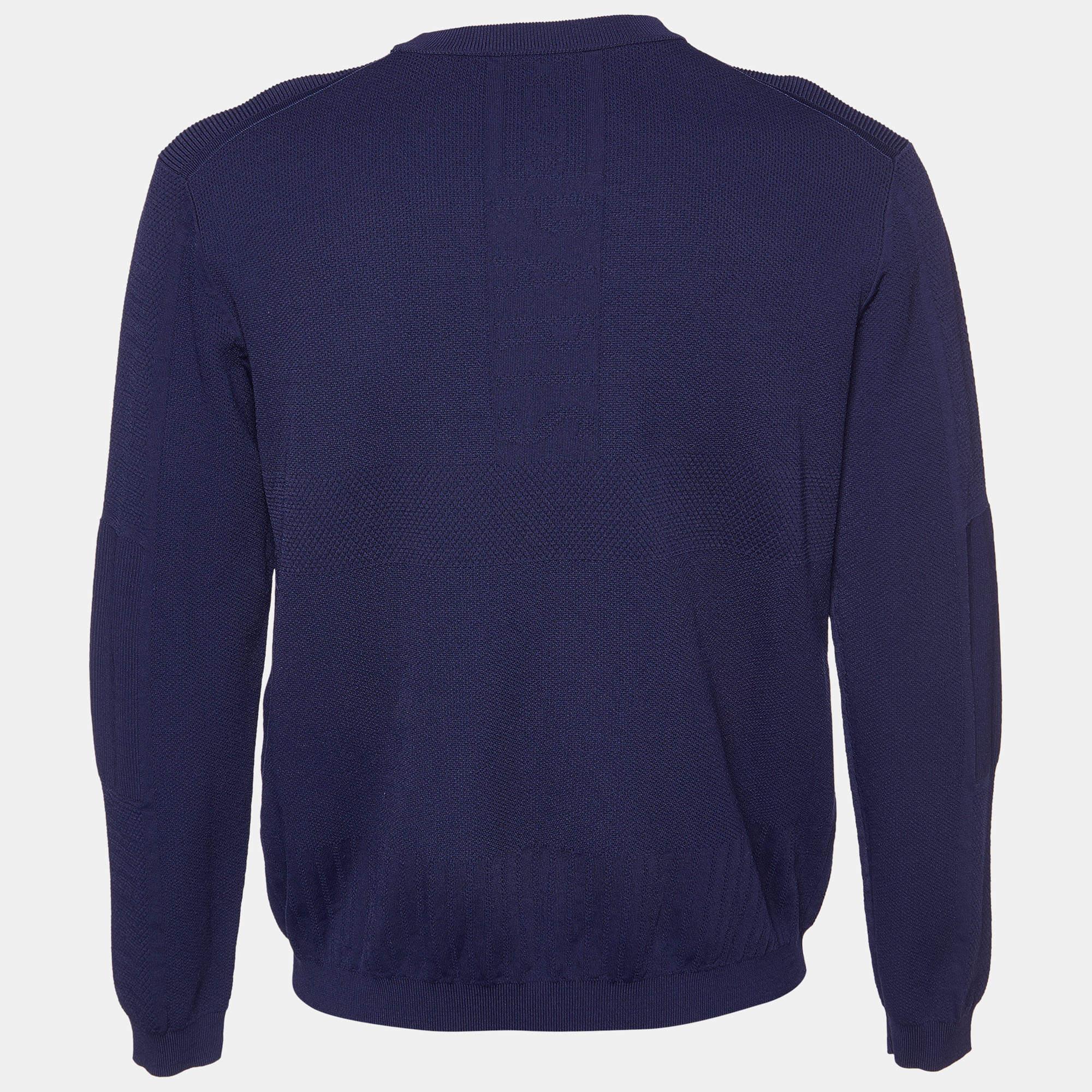 This comfortable navy blue jumper from Kenzo will remain a wardrobe staple complementing jeans to tailored pants. It has a knit construction with a round neckline and long sleeves.