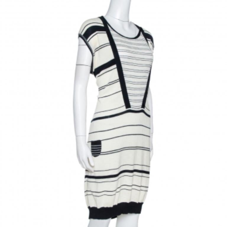 This stylish dress from the house of Kenzo is sure to have your attention almost instantly. Be it a day affair or a night event, you cannot go wrong with this off-white dress. Made in cotton knit, this sweater dress features one pocket and navy
