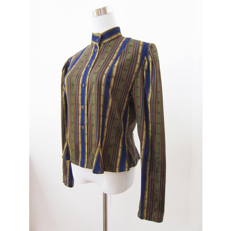 KENZO Paris beautiful ethnic Mao collar jacket with tobacco brown, green, blue and yellow stripes. Matching trouser, shawl with 2 zip pockets. Various ways of style. Made in France. 
Size : 42 (Fr)



