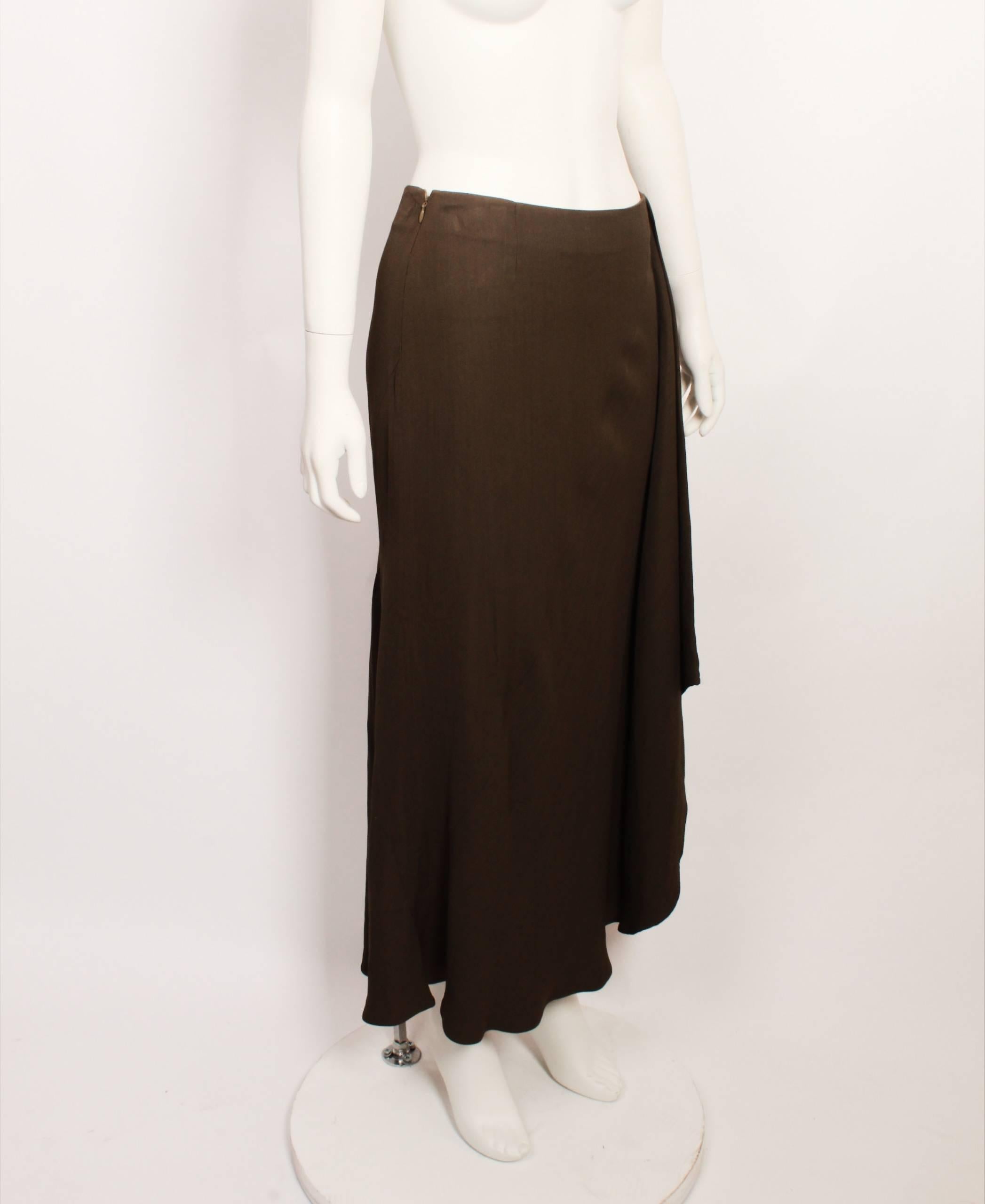 Incredible vintage KENZO Paris khaki  skirt. Asymmetrical on one side with hidden zipper up the side with hook-and-eye closure. In great condition. Made in France. Marked Size EU 38