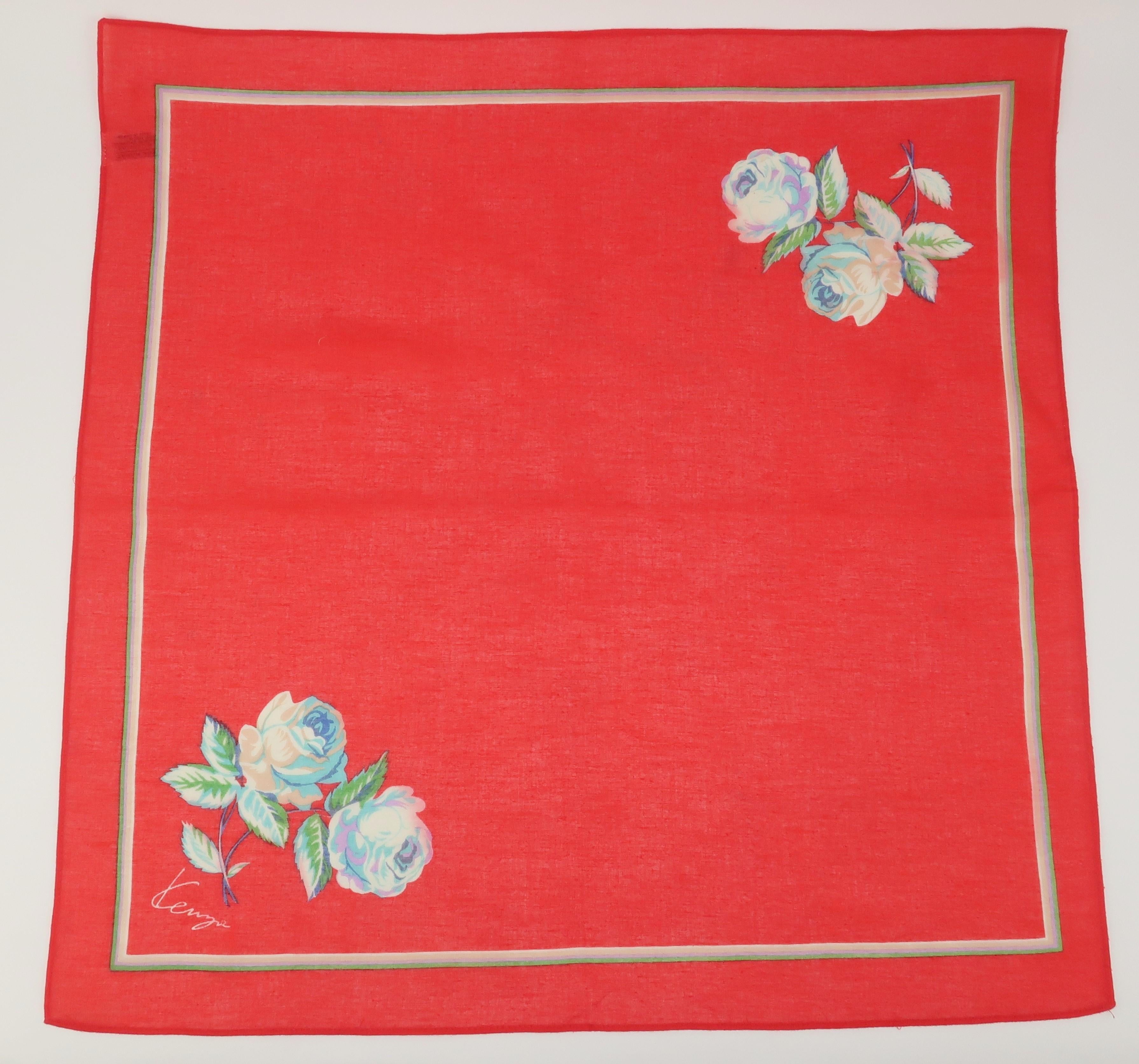 1980's red floral cotton scarf by Japanese designer, Kenzo.  The simple scarf displays a border in shades of green, purple and beige and traditional roses in shades of beige, blue, lilac and green.  Perfect for a neckerchief, head scarf or hankie.