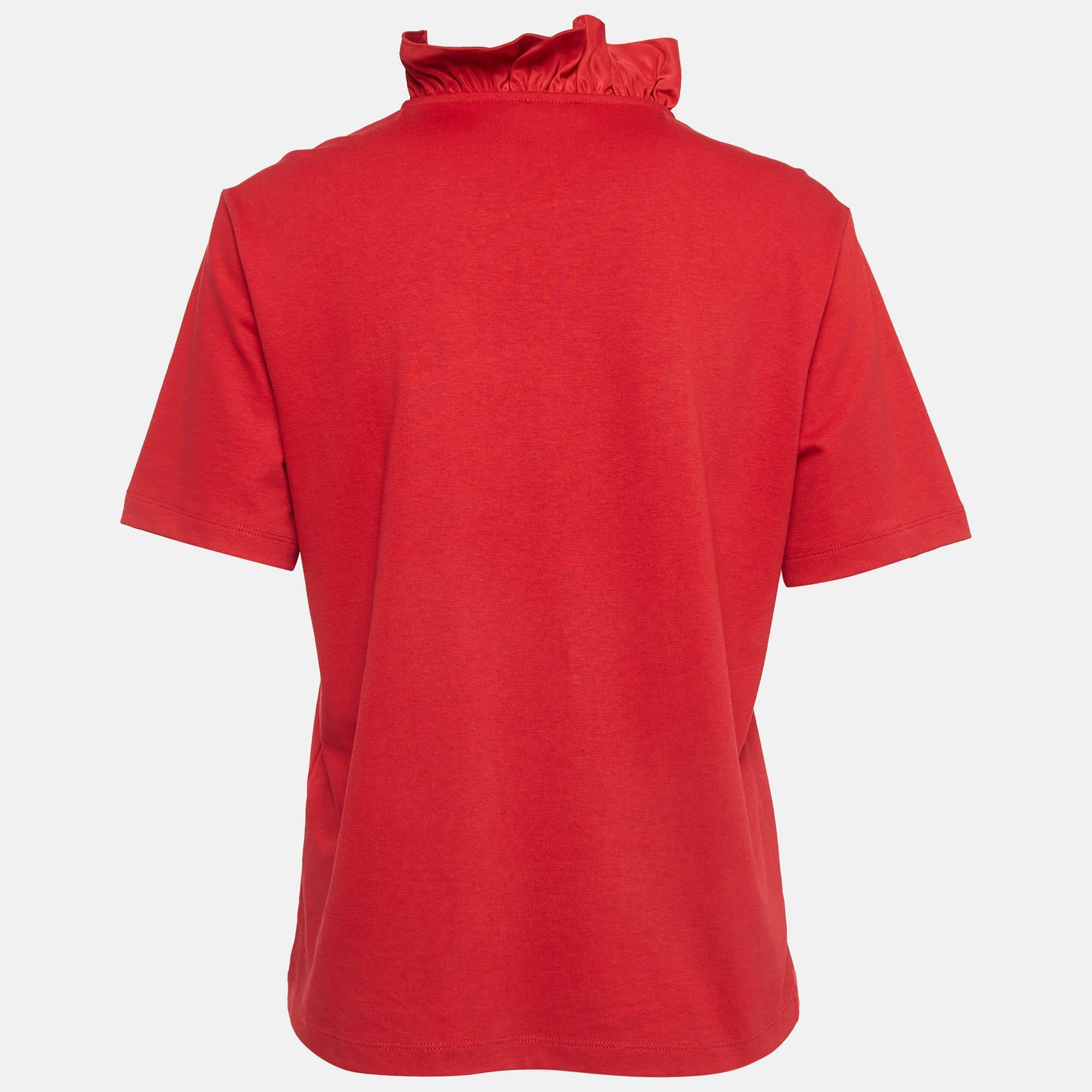 This Kenzo top blends a feminine silhouette and a bold design for a successful modern look. The ruffles around the neckline give a stylish demeanor and colorful embroidery showcases the KENZO Tiger motif on the front.