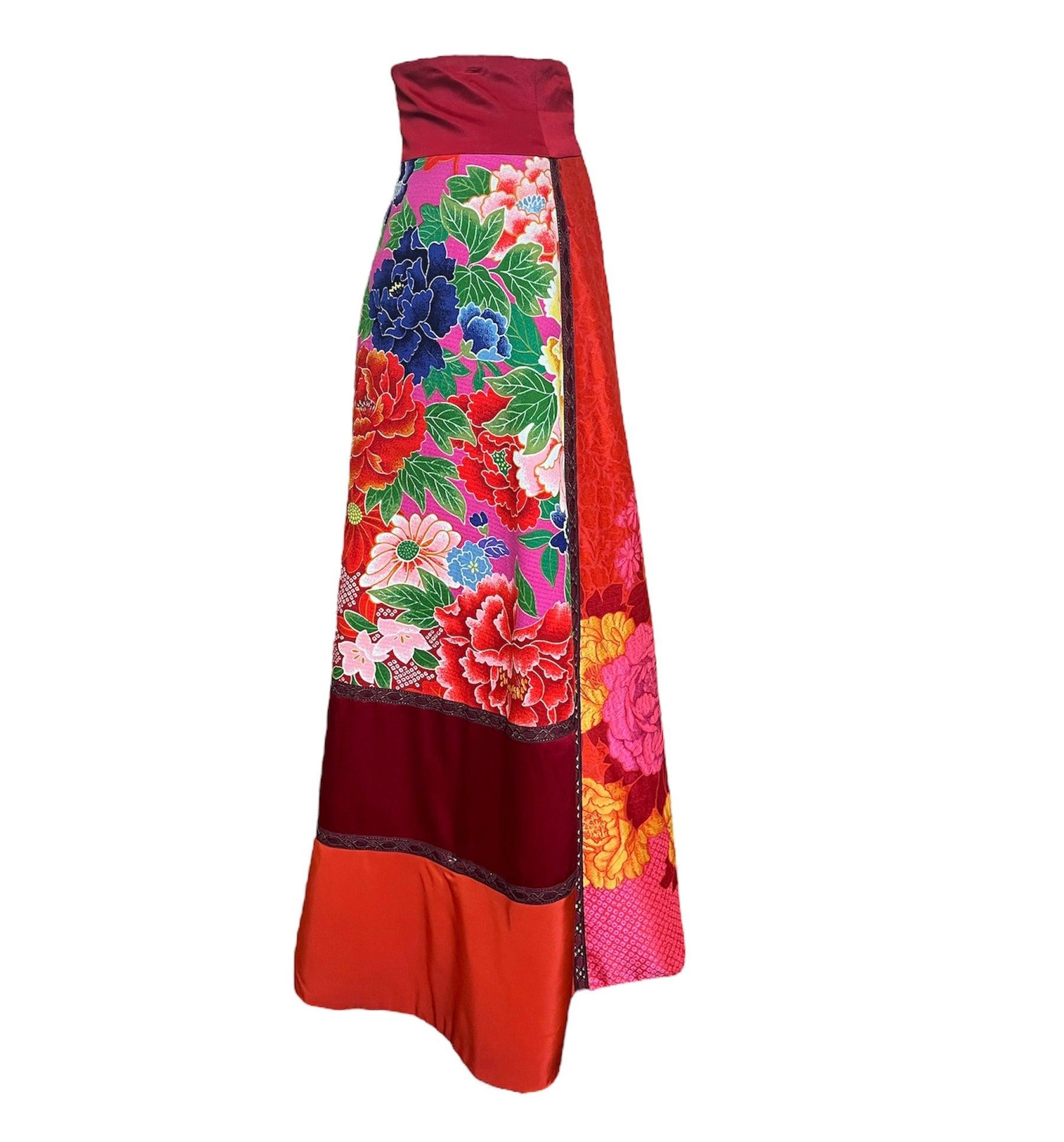 KENZO 2000’s silk/rayon blend  patchwork maxi skirt. Wrap-around style with braided trim, and covered button closure at waist. Fully lined and equipped with pockets! The patchwork design borrows prints and patterns from Japanese kimono. 

Additional