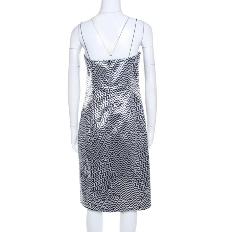You cannot go wrong with an impressive dress like this one from Kenzo. Be the epitome of poise and grace when you effortlessly style this metallic dress with high heeled booties and chain clutch for your evening look. Made from the finest blended