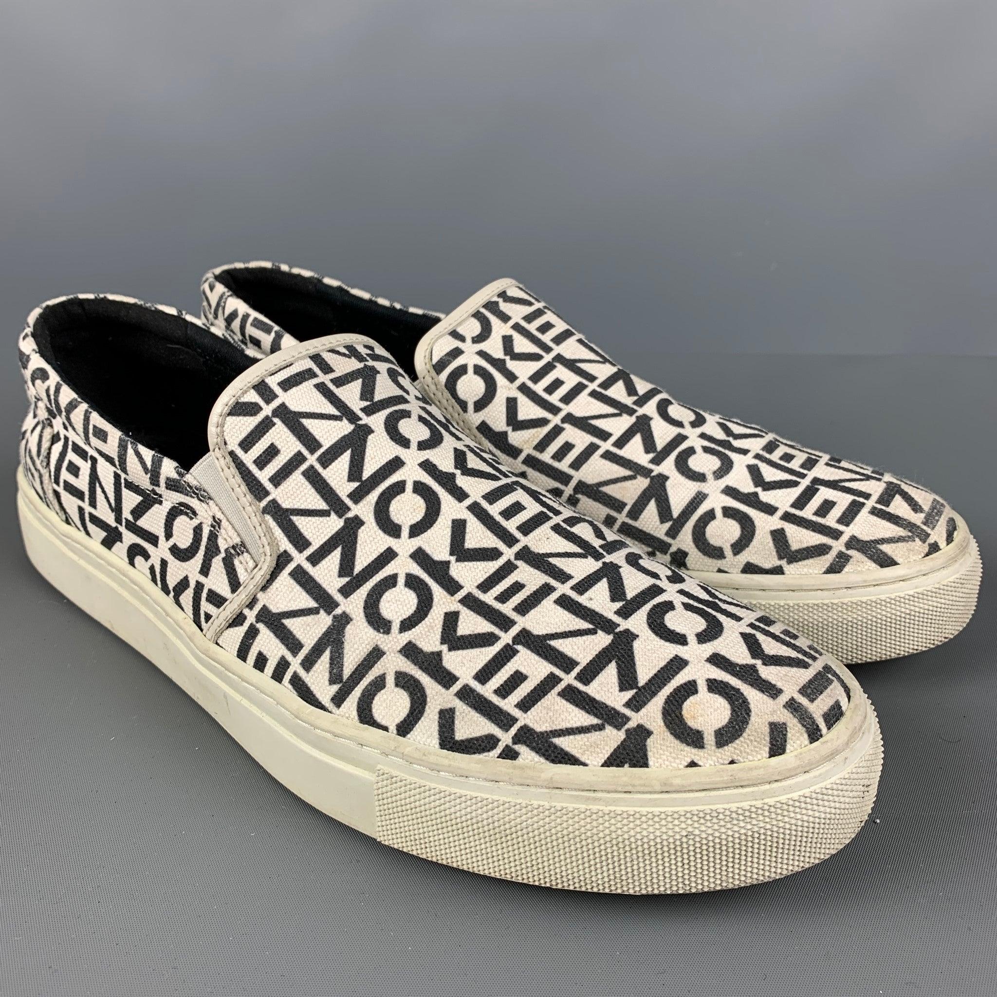KENZO sneakers comes in a black and white logo canvas featuring a slip on style and a rubber sole. Very Good Pre-Owned Condition. 

Marked:   43Outsole: 12 inches  x 4 inches  
  
  
 
Reference: 124253
Category: Sneakers
More Details
    
Brand: 