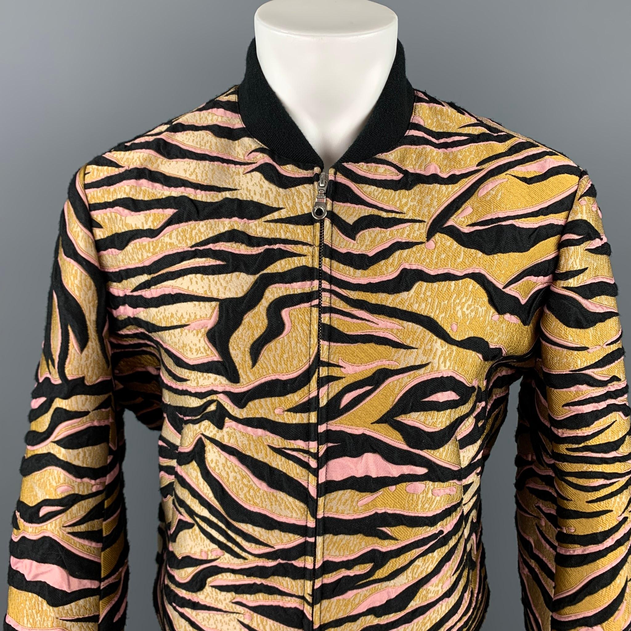 KENZO jacket comes in a gold & black jacquard polyester blend with a full liner featuring a bomber style, ribbed hem, slit pockets, and a zip up closure.

Very Good Pre-Owned Condition.
Marked: L

Measurements:

Shoulder: 18.5 in.
Chest: 46