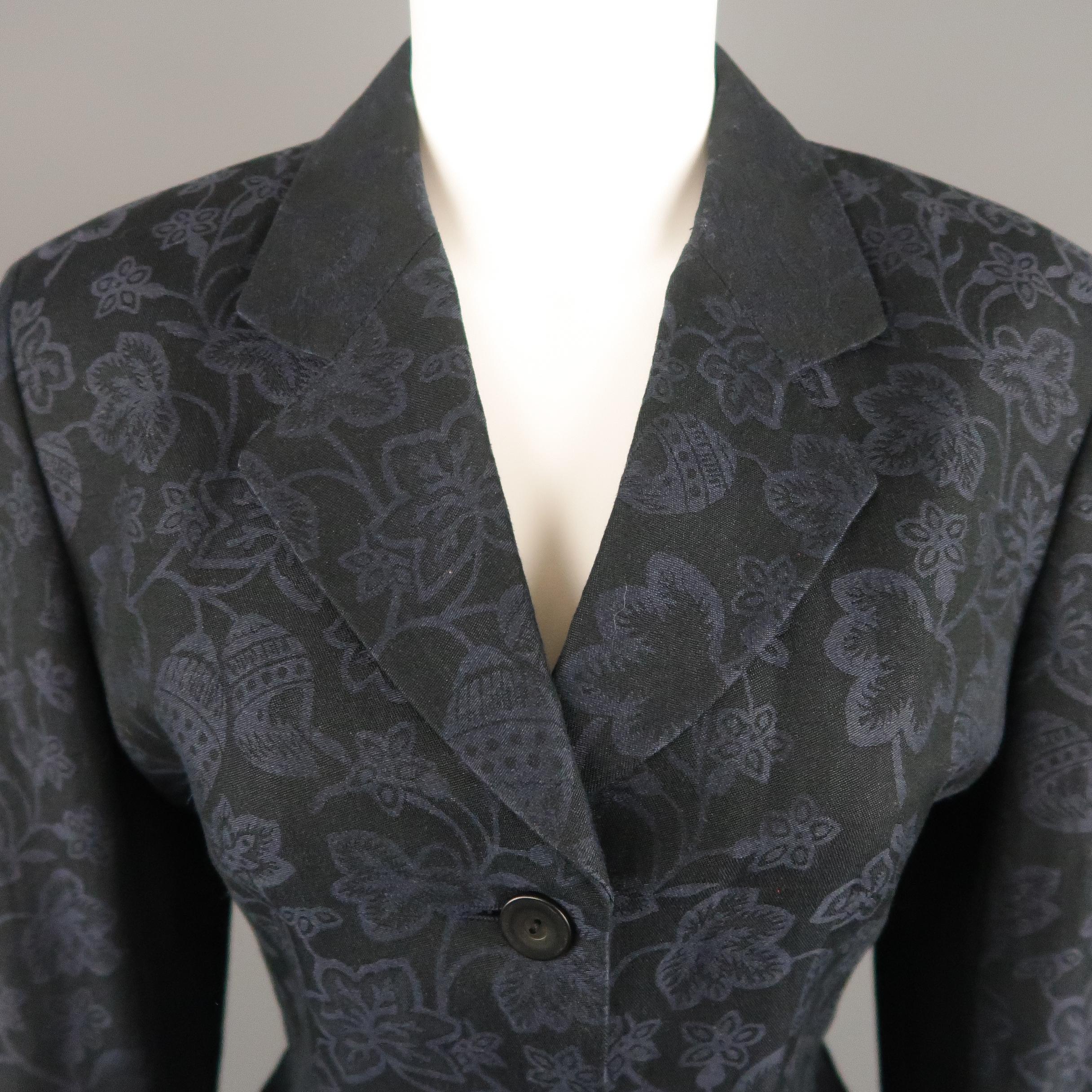 KENZO fashion blazer comes in navy floral print fabric with a notch lapel, tailored silhouette, and single breasted three button front. Missing button on cuff. As-is.
 
Very Good Pre-Owned Condition.
Marked: (no size)
 
Measurements:
 
Shoulder: 16
