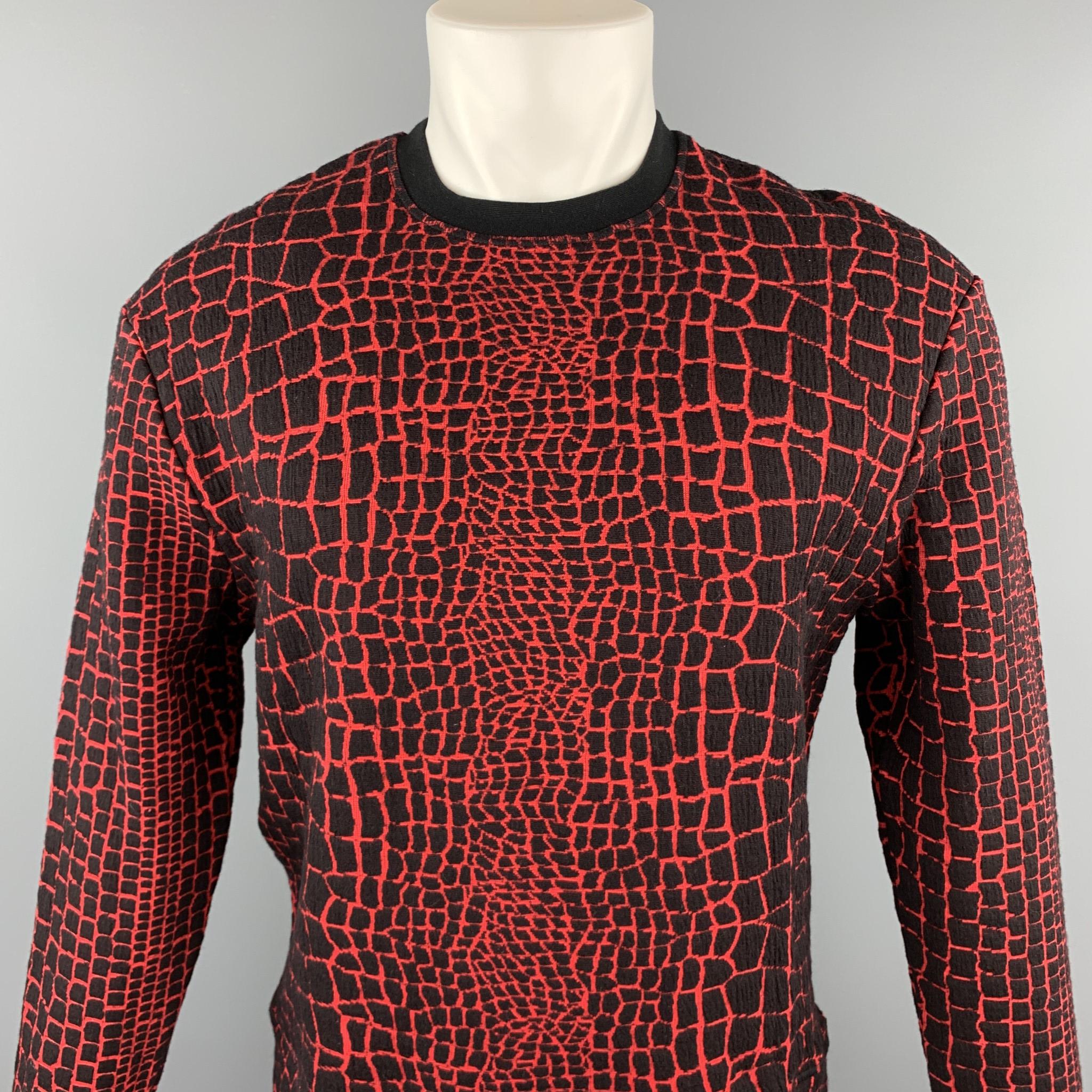 KENZO sweatshirt comes in a black & red alligator print cotton blend featuring a crew-neck. Made in Portugal.

New With Tags.
Marked: M

Measurements:

Shoulder: 20 in. 
Chest: 42 in. 
Sleeve: 22.5 in. 
Length: 23.5 in.