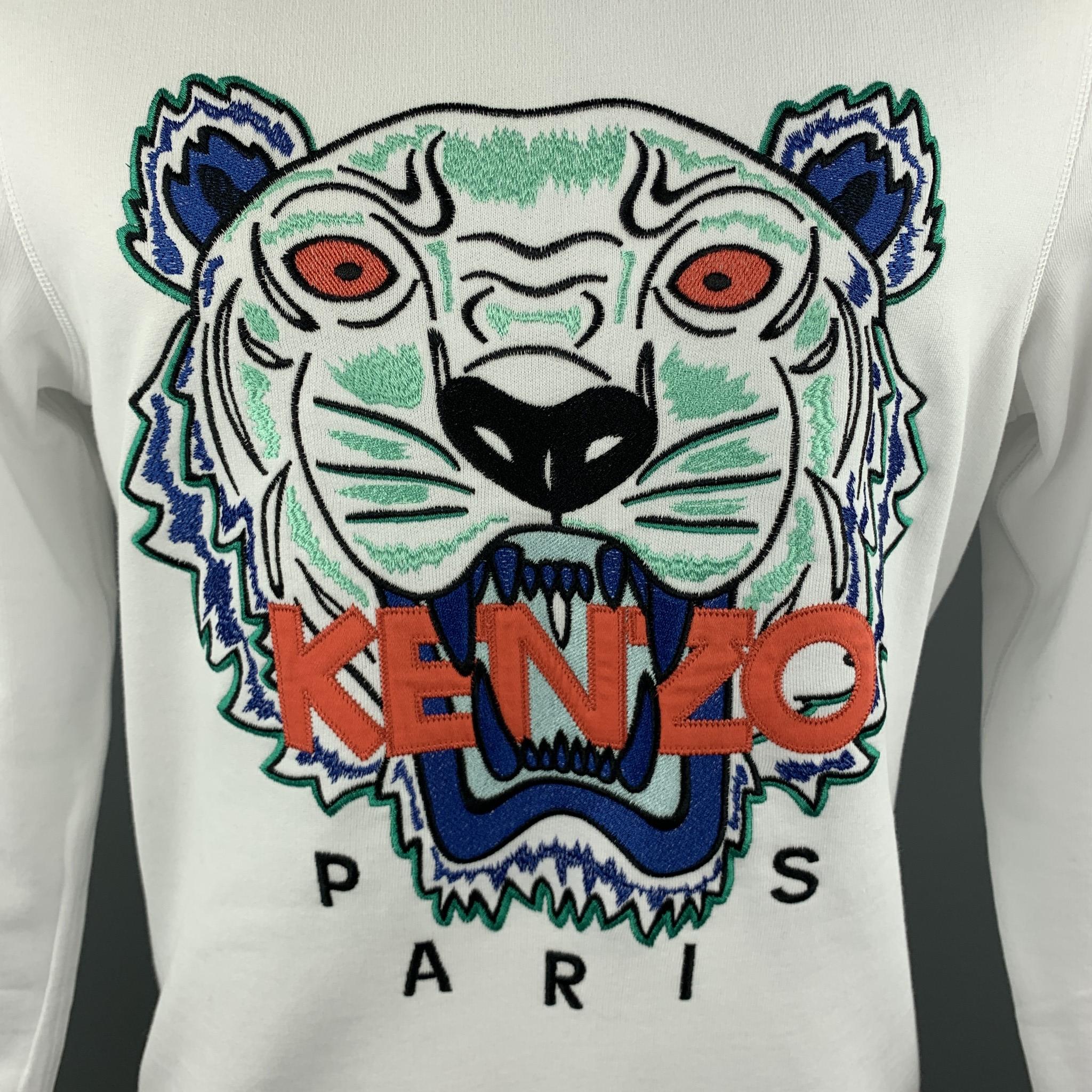 KENZO pullover sweater comes in white jersey knit with a crewneck and iconic ikat tiger logo embroidery graphic in a blue and orange colorway. Made in portugal. 

New with Tags.
Marked: M

Measurements:

Shoulder: 17 in.
Chest: 40 in.
Sleeve: 27