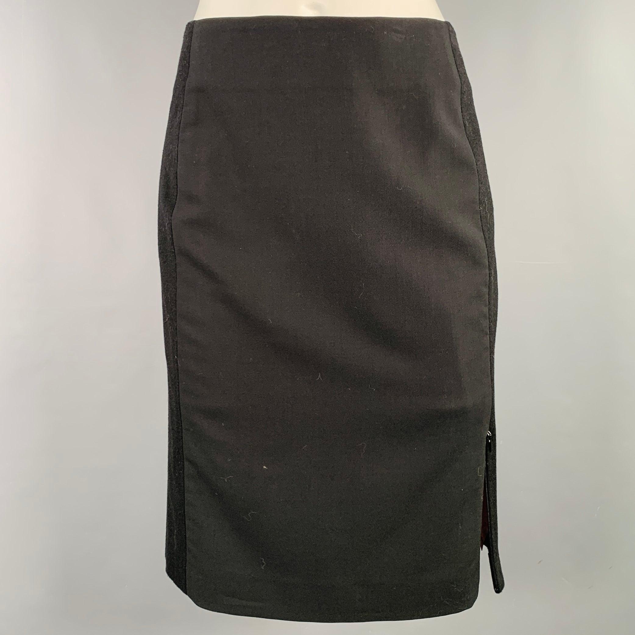 Gonna Kenzo Jungle
in tessuto misto lana nero con stile a matita, tessuti misti, due spacchi e chiusura con cerniera invisibile. Made in France.Ottime condizioni di usato. Marchio minore. 

Contrassegnato:   FR 36 

Misure: 
  Vita: 26 pollici 